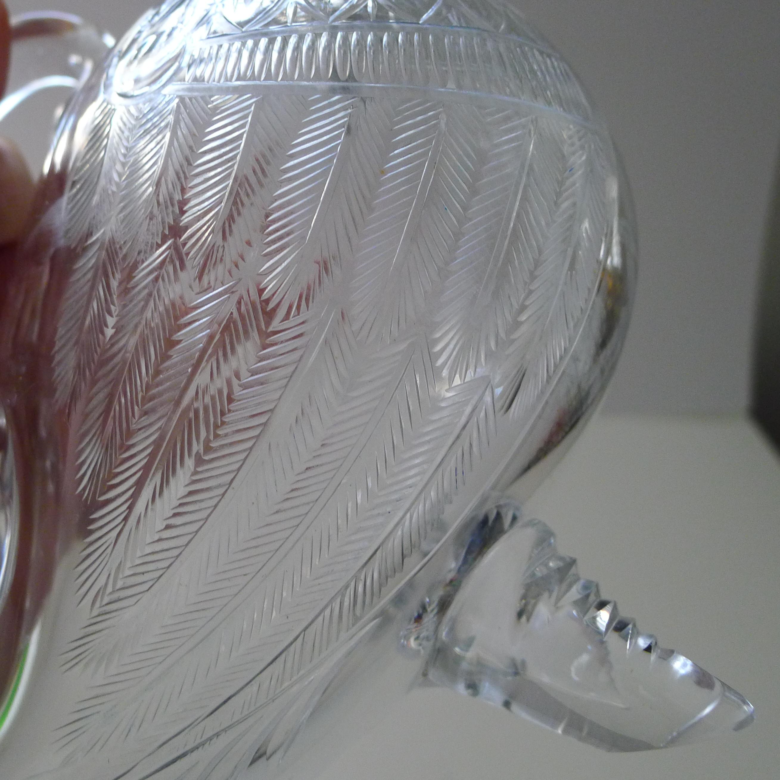 A magnificent and rare English cut glass novelty decanter / claret jug in the form of a charming duck.

The body is beautifully hand-cut with superb detail such as the feathers. The top is again beautifully made in the from of the duck head with a
