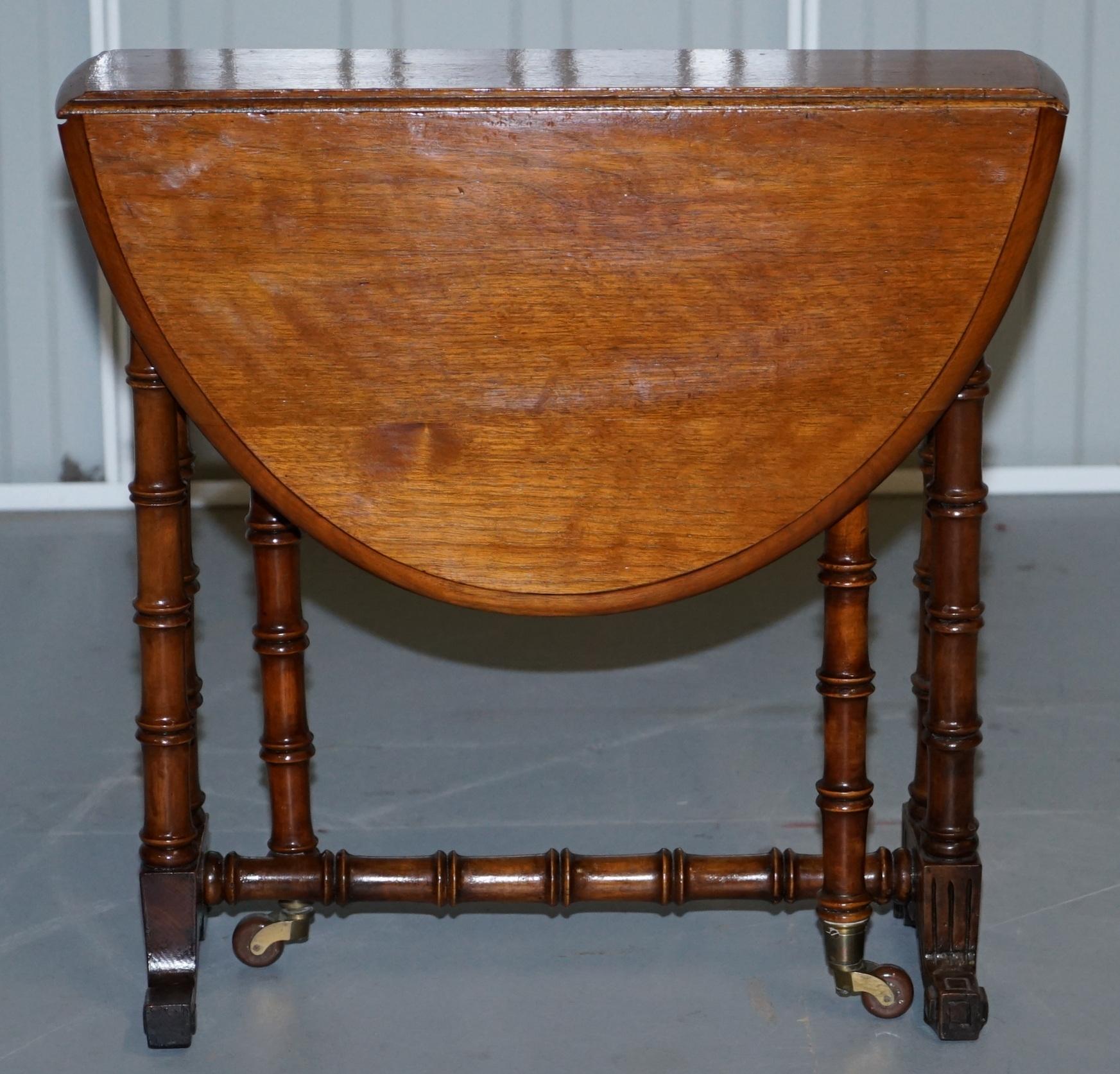 We are delighted to offer for sale this rare original Victorian Walnut with porcelain castors salesman sample gateleg table with famboo frame

This is a rare little piece, it is as mentioned a salesman sample, if you’re not familiar basically in