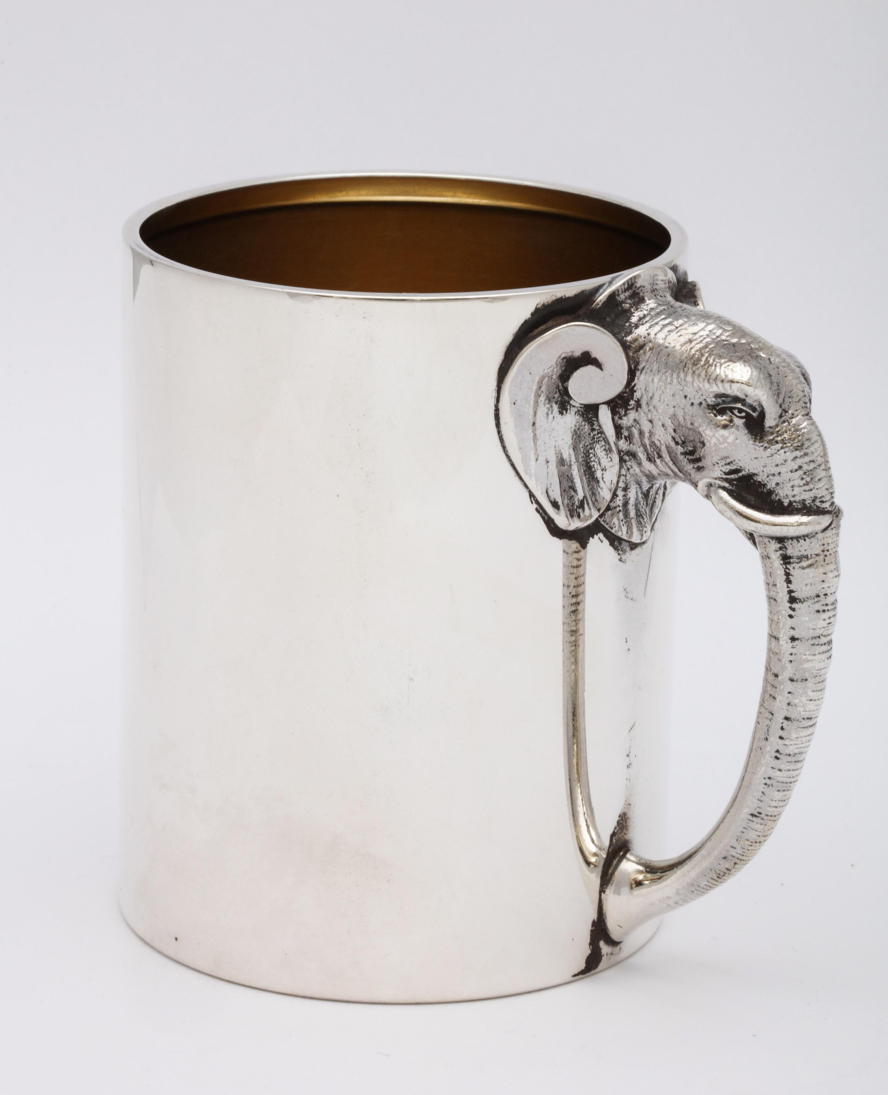 Rare, unusual, Victorian sterling silver mug/cup with elephant-form handle, Gorham Manufacturing Company, Providence, Rhode Island, year hallmarked for 1882. Gilt interior. Detailed handle is in the form of an elephant's head and trunk. Measures 3
