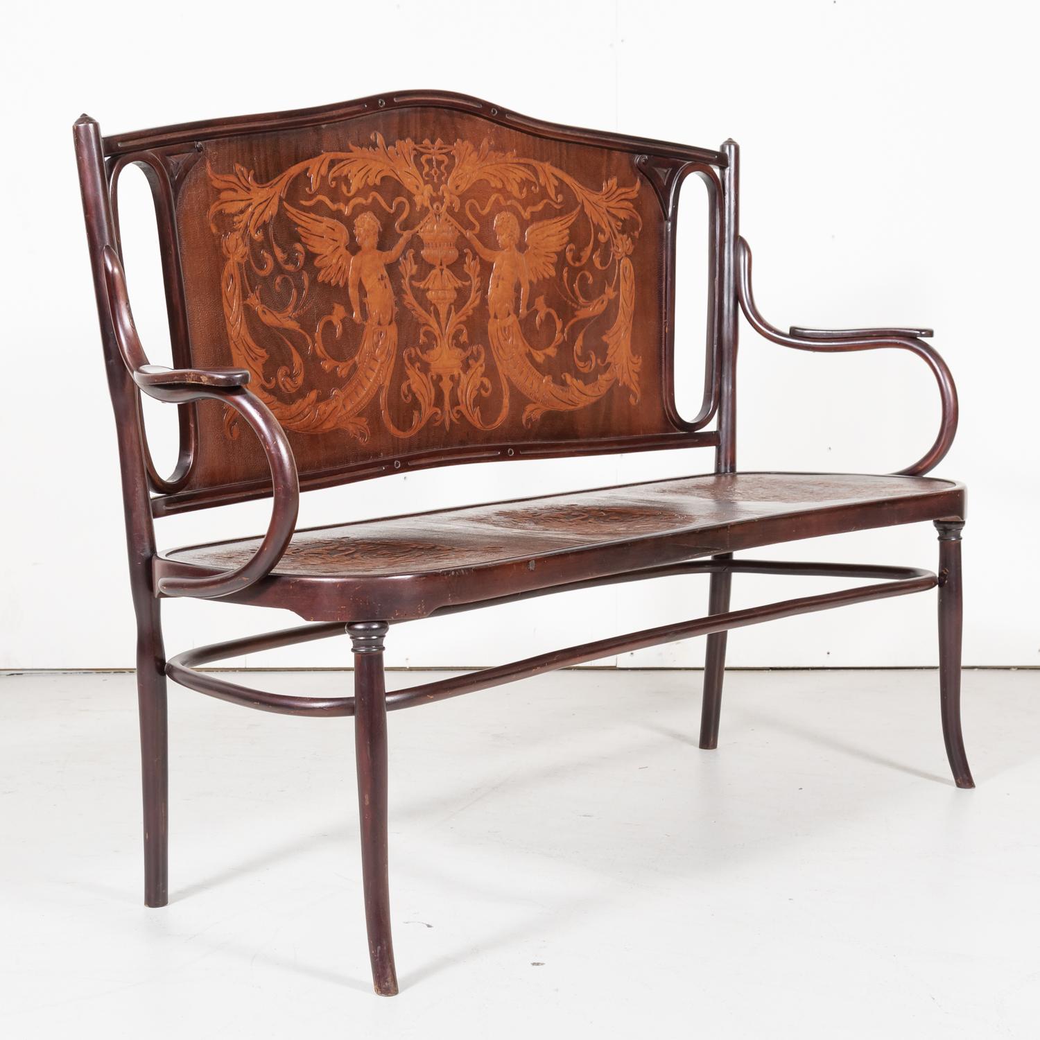 A rare Vienna Secession J. & J. Kohn bentwood bench, circa late 1800s-1902 designed and manufactured by the famed father and son duo, Jacob and Josef Kohn of Vienna, Austria. Having a beechwood frame, embossed/pressed seat and backrest, flaring