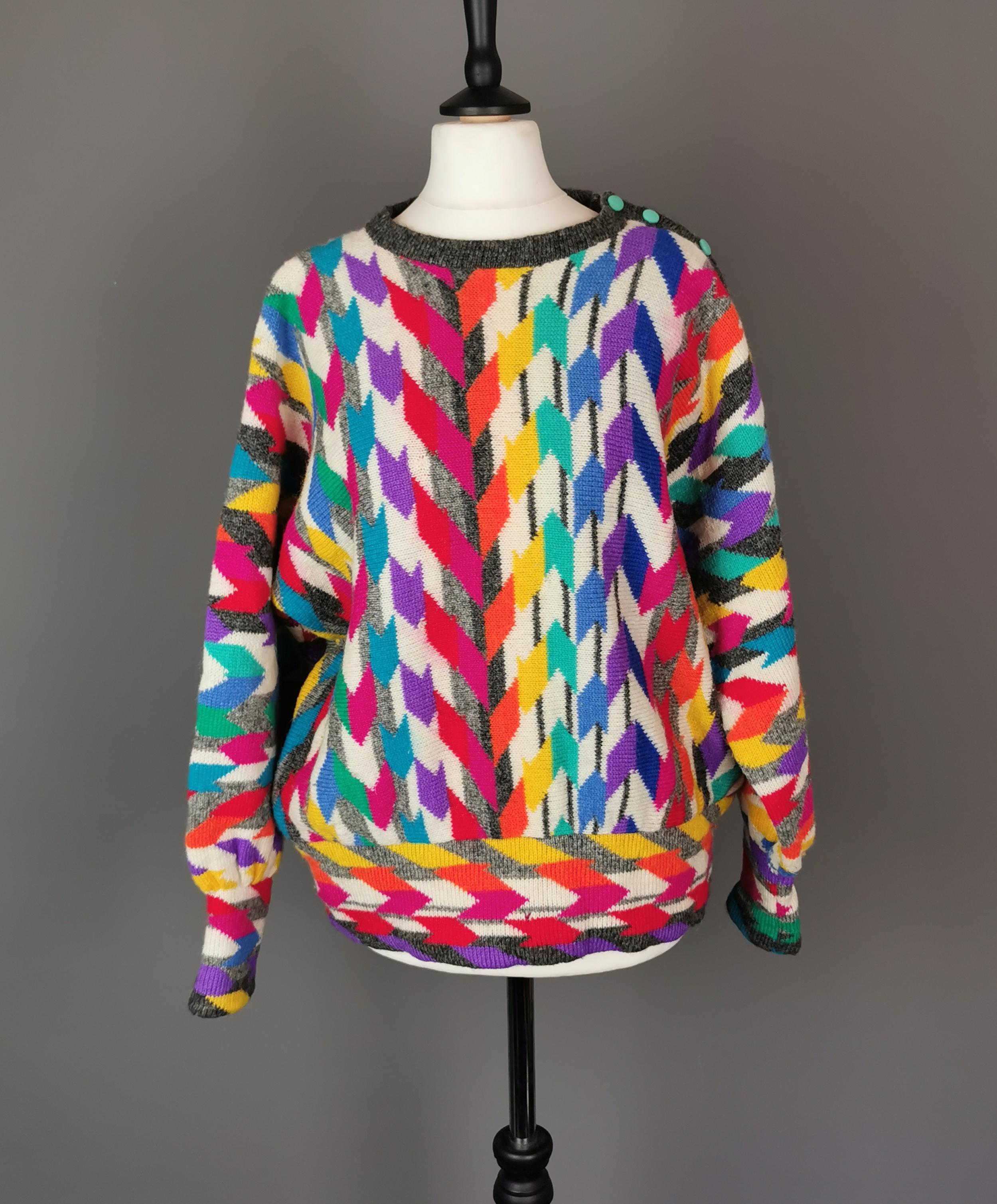 A rare vintage 1980s funky and colourful zig zag or chevron knit wool sweater or jumper.

This is the epitome of the 1980s and original 80s knitwear is in popular demand, this Maggie White design is extremely well made and super wearable