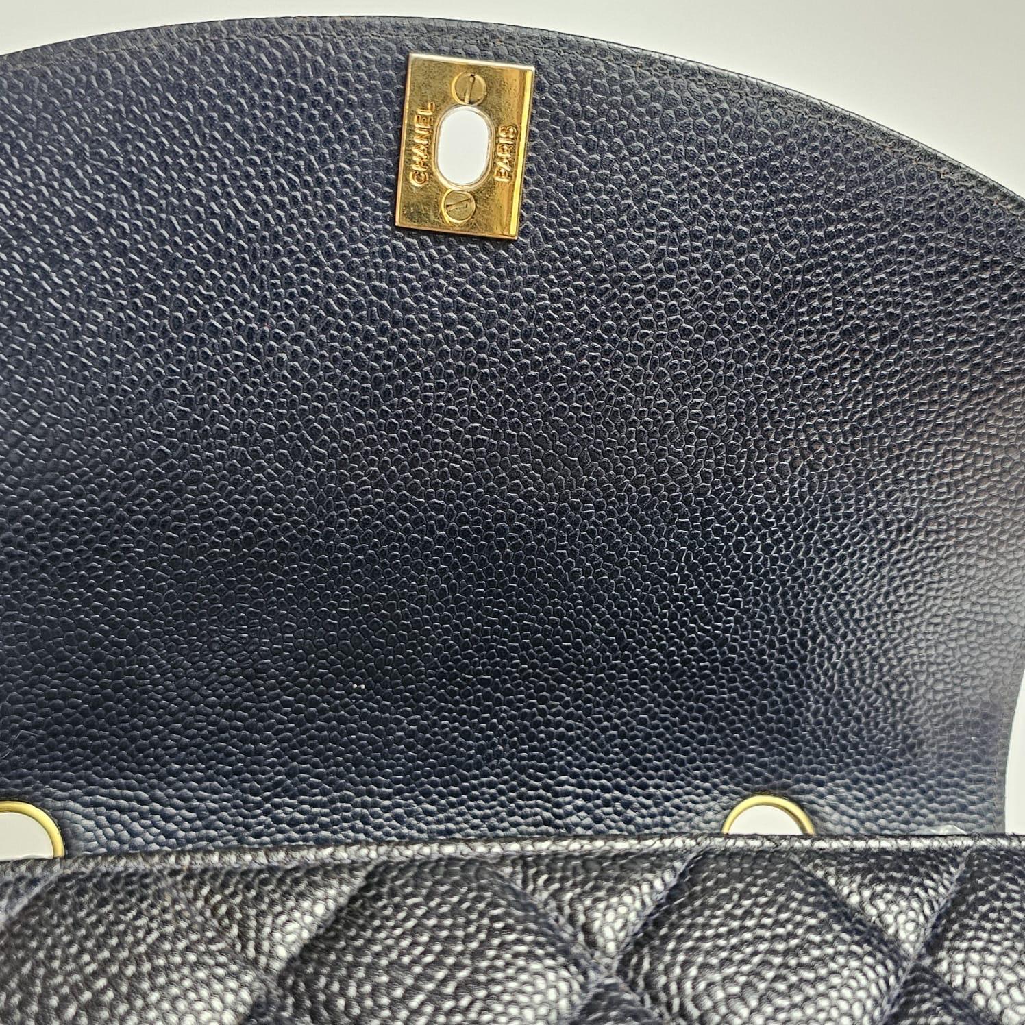 Vintage classic small diana bag in black caviar leather with gold hardware. Slight creasing and rubbing on the leather corners and strap. Minor touch ups has been professionally done. Structure is still firm. Comes with its holo intact as is. Series