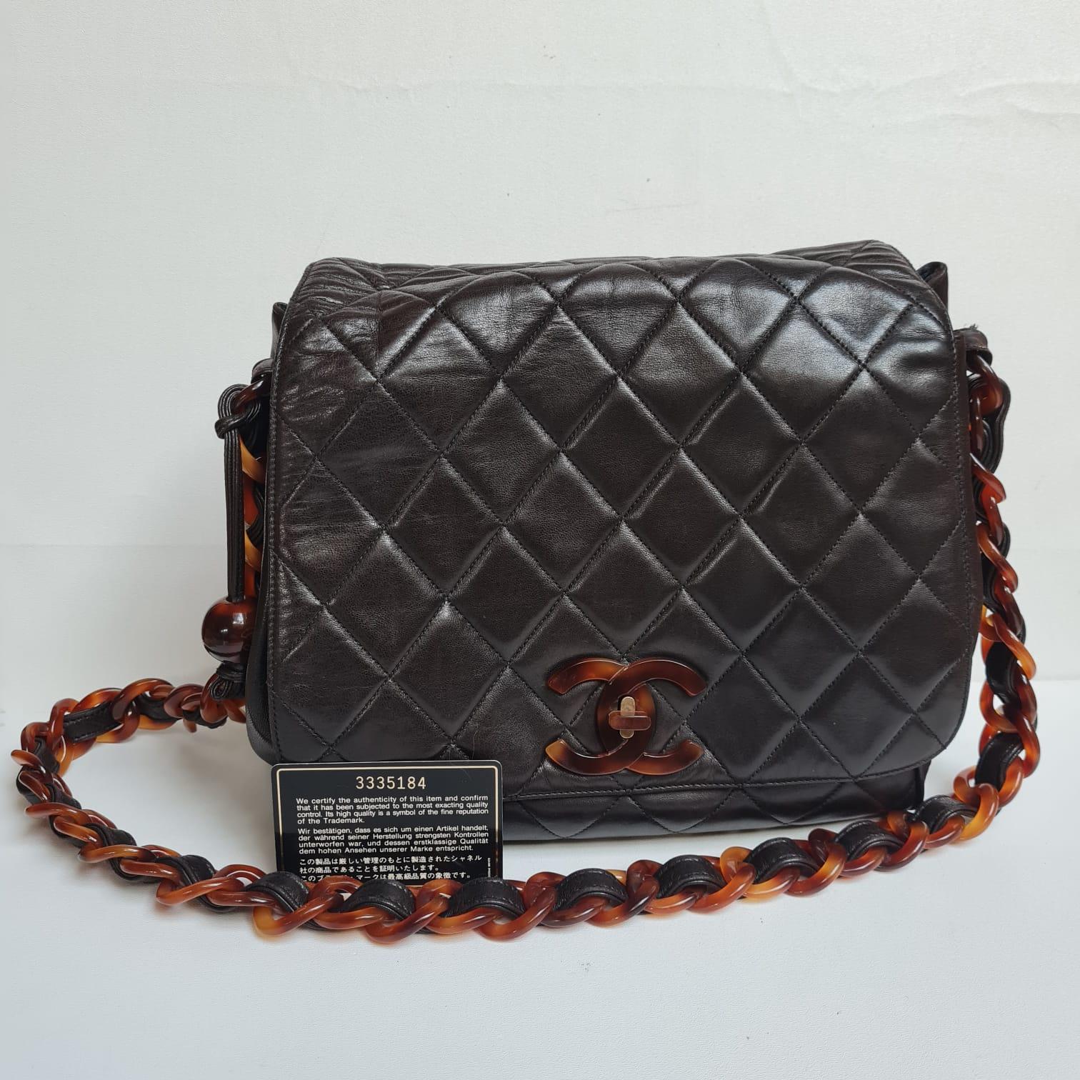 Rare vintage chanel bag with tortoiseshell clasp and chain detail. Still in great condition. Light scuffs and press marks on the exterior leather but nothing major. Tortoiseshell detail in good condition overall. Series #3. Comes with its card and