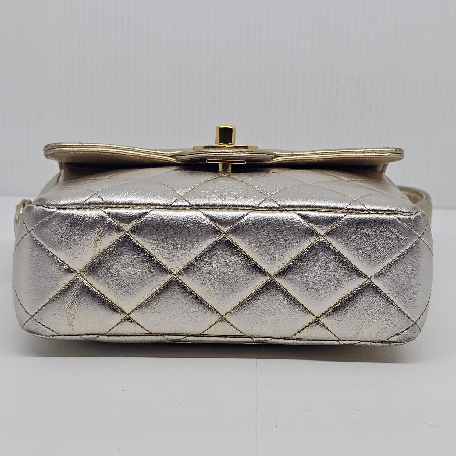 Rare vintage piece in mini size. The bag has an ombre effect of silver and gold. Minor scuffing and marks on some parts, but overall still in very good vintage condition. Series #3. Minor rubbing on the corners. Comes with its holo intact and