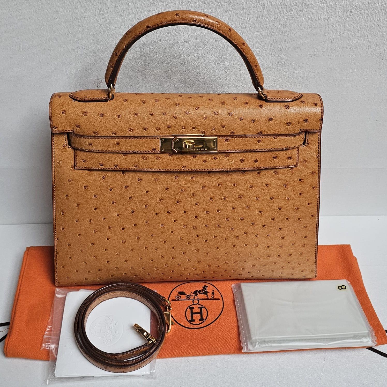 Beautiful vintage kelly ostrich in cognac (gold-like) with gold hardware. Minor scratch on the bottom part of the flap. Light tarnishing and marks on the leather but overall still in pristine vintage condition. Stamp Circle X (1994). Comes with its