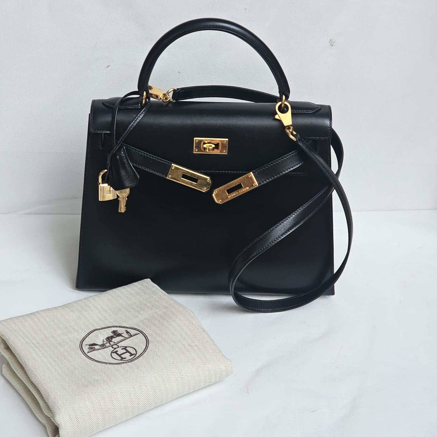 The ultimate classic vintage bag. Classic kelly 28 in black box leather with gold hardware. Slight scuffs and scratches on the surface of the leather due to wear and storage but overall still in very good vintage condition. Minor tarnishing on the