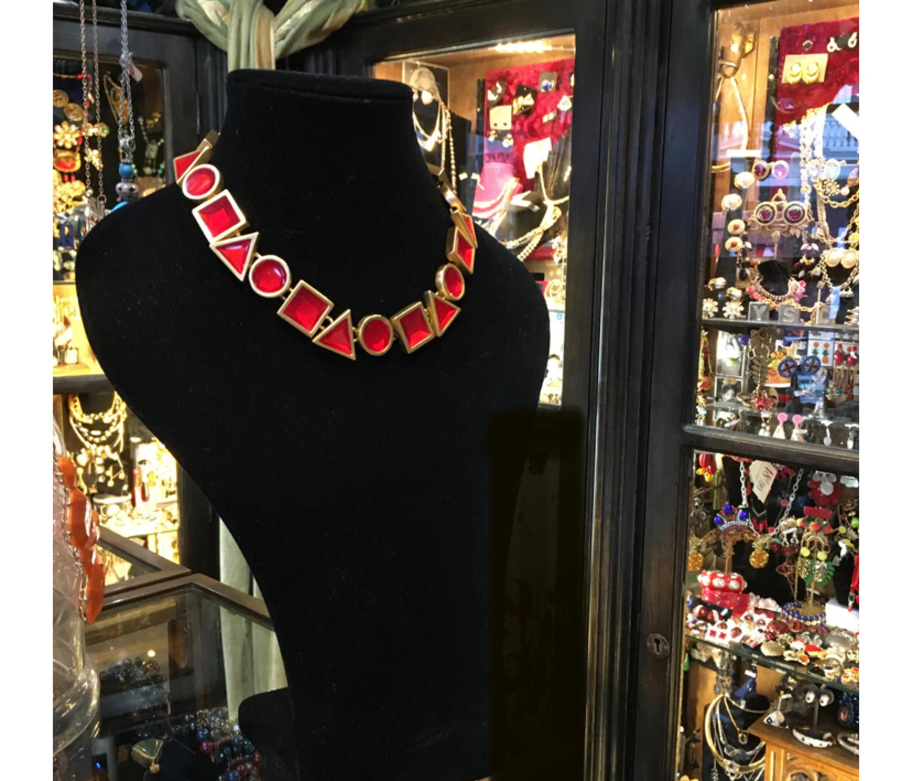 
Incredible vintage necklace by Anne Klein. This is a true burst of color in a rare piece that is sculptural and unique.  Created with artistry and detail, resin and brass combine to create a variety of shapes that present a playful and vibrant