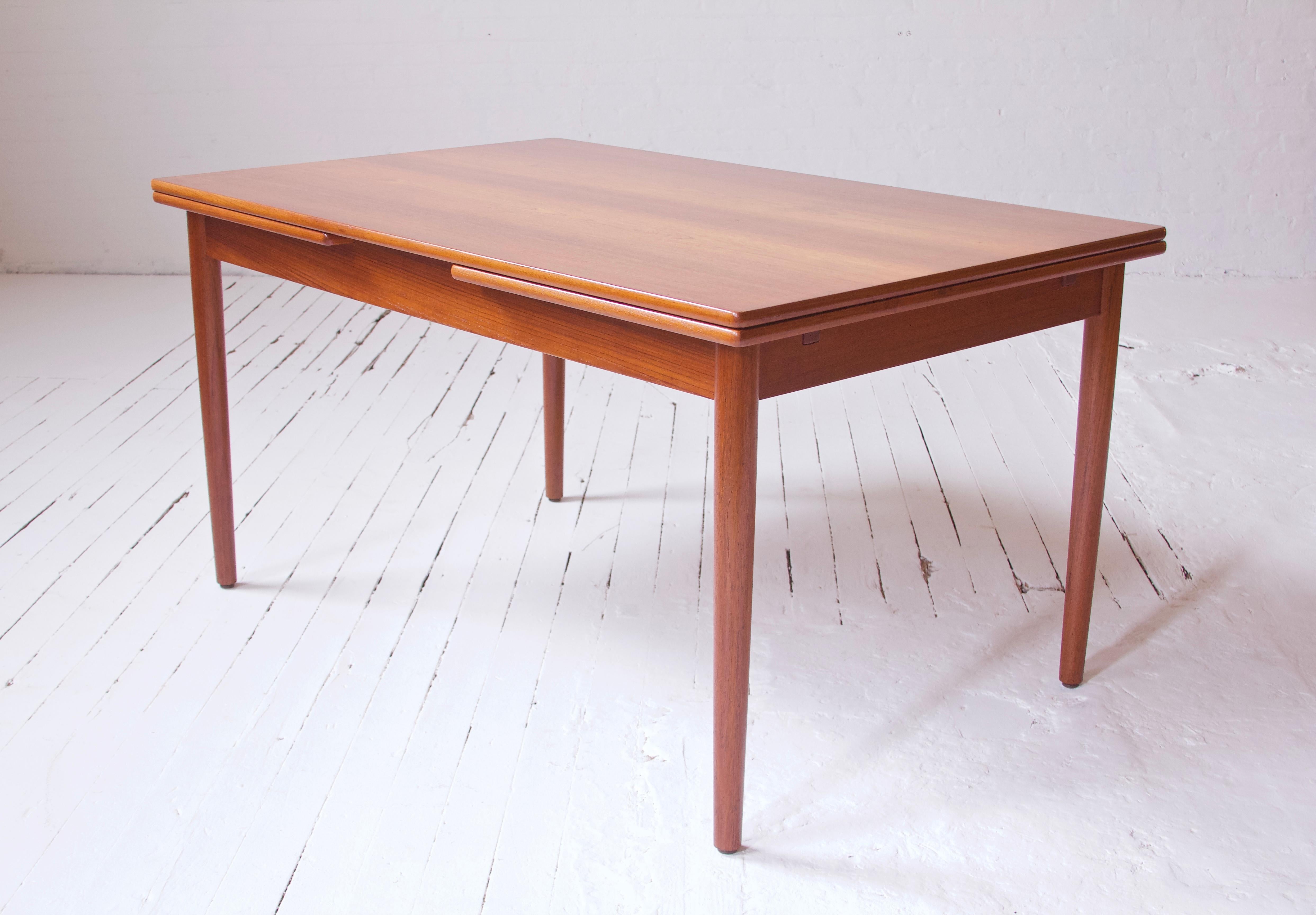 Rare Vintage AT-316 Hans J. Wegner extension dining table in teak, 1960. An attractive and ingeniously designed extension table designed by Wegner for Andreas Tuck, circa 1960. 

Featuring solid wood, tapered extension leaf slides, this table's