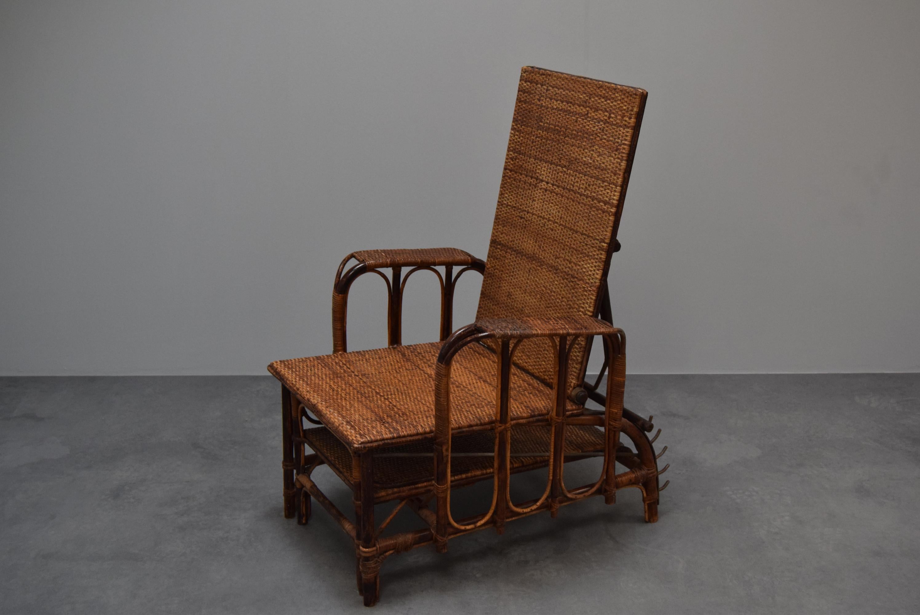 
This bauhaus-style armchair was designed by Erich Dieckmann in Germany during the 1930s.
This Chair is made from three kinds of materials:Rattan, Bamboo and Metal.
The chair has some parts repaired in the past.
Other dimensions: Depth when unfolded