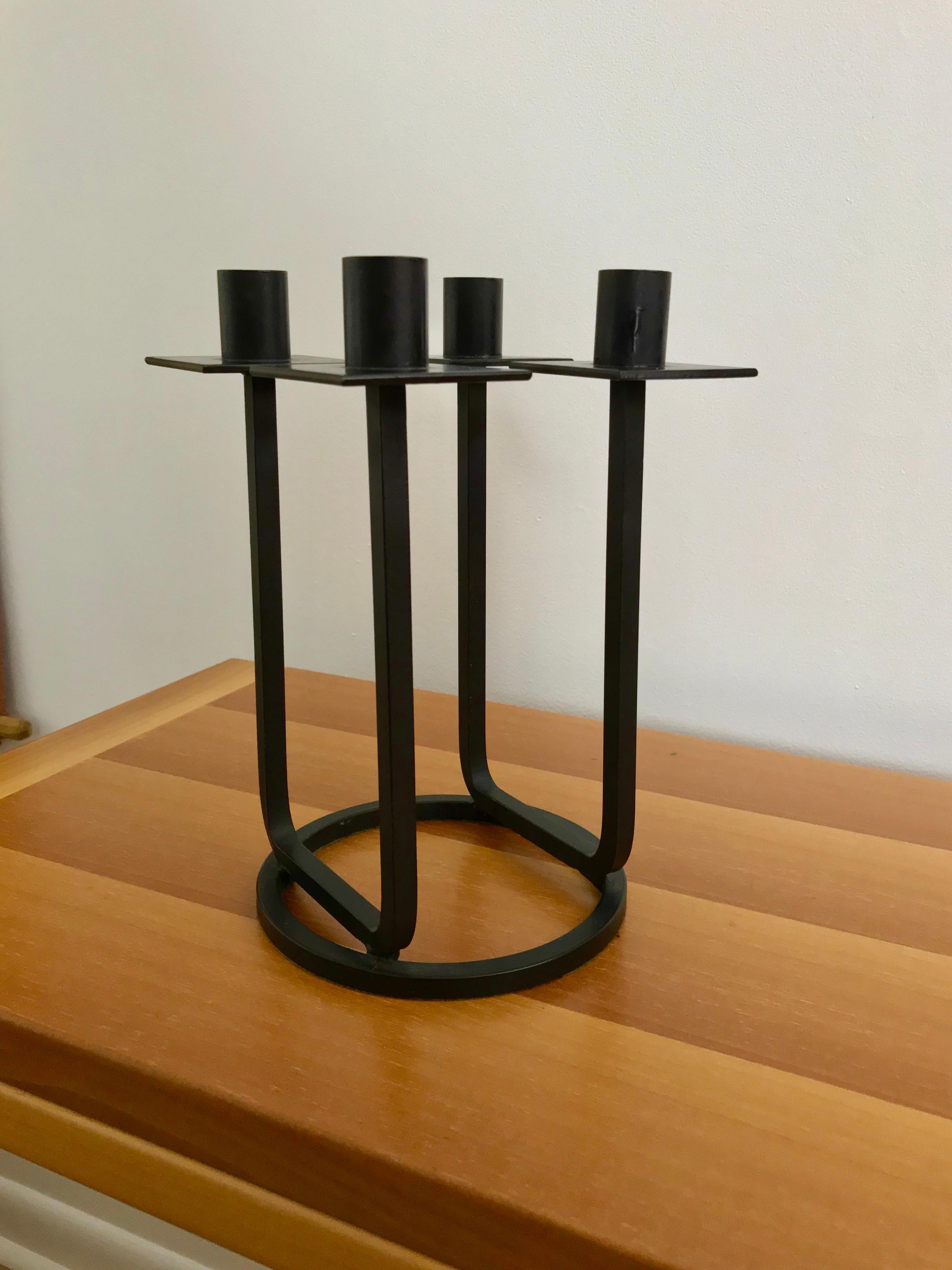 A black bent iron candlestick designed by Hendrik Van Keppel and Taylor Green of Van Keppel - Green, Beverly Hills, California. The candlestick is black painted iron, designed / manufactured in the 1950’s and measures approximately 9 3/4 inches high