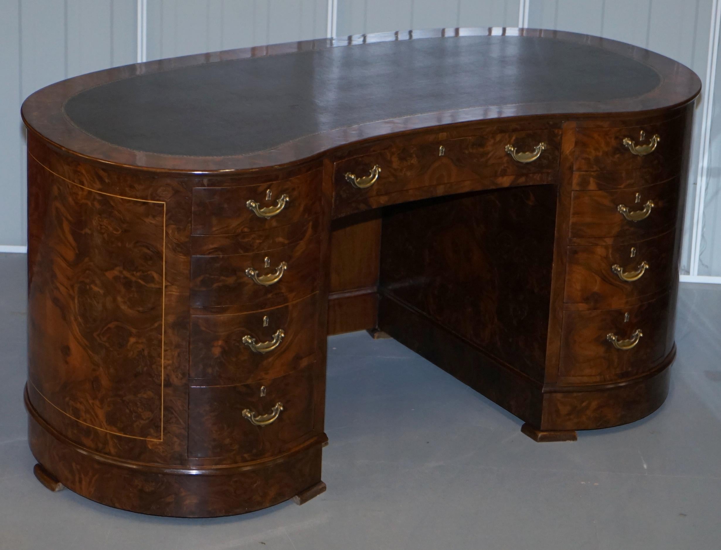 We are delighted to offer for sale this absolutely stunning burr and burl walnut twin pedestal kidney desk with twin cupboard bookcases to the rear

A very good looking well made and decorative twin pedestal desk, rare to find in the kidney form.