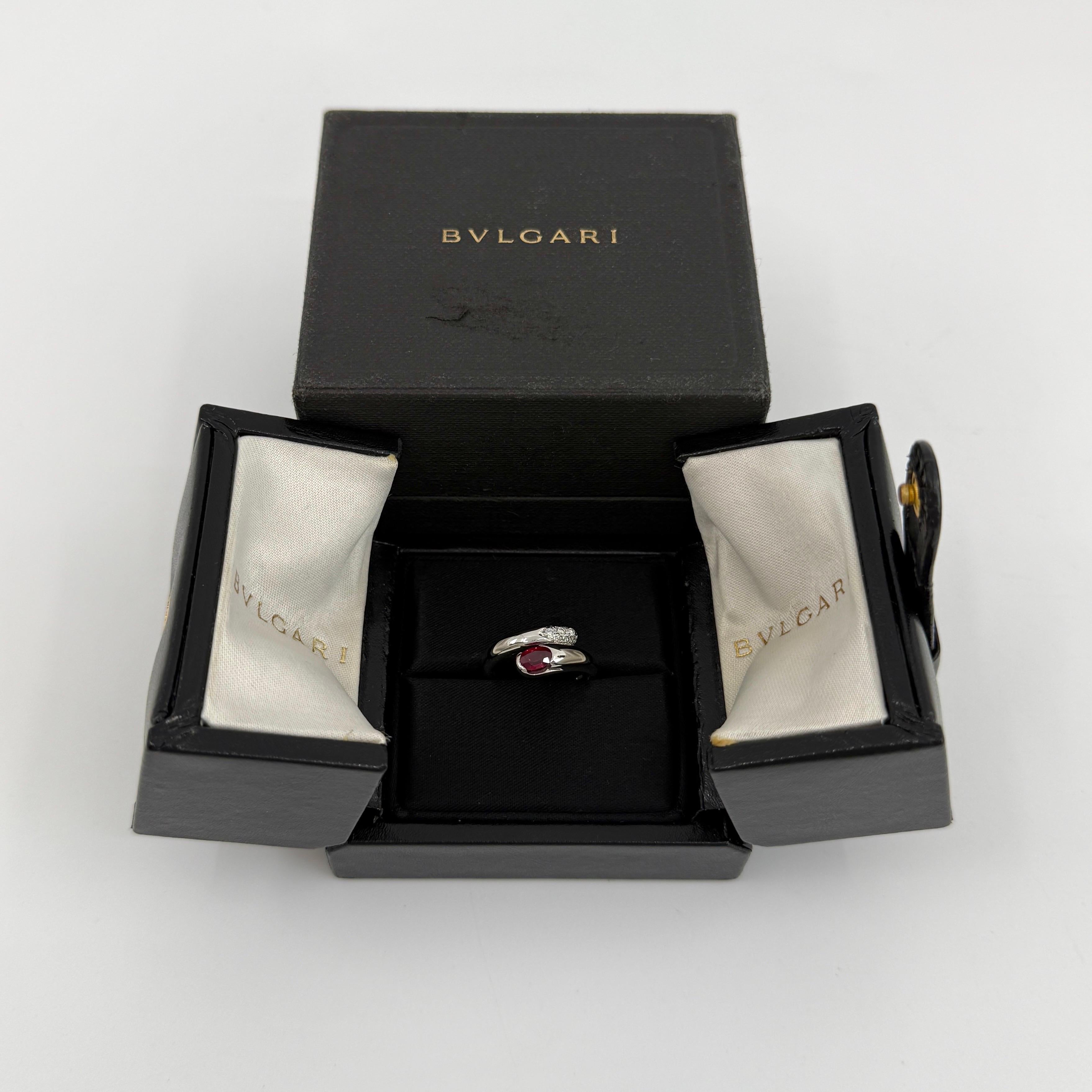 Rare Vintage Bvlgari Astrea Oval Cut Vivid Red Ruby 18k White Gold Bypass Ring.

The classic Bvlgari snake theme from the modern Astrea line, this 18k white gold bypass ring wraps beautifully around the finger with a bypass ring style.
The ring is