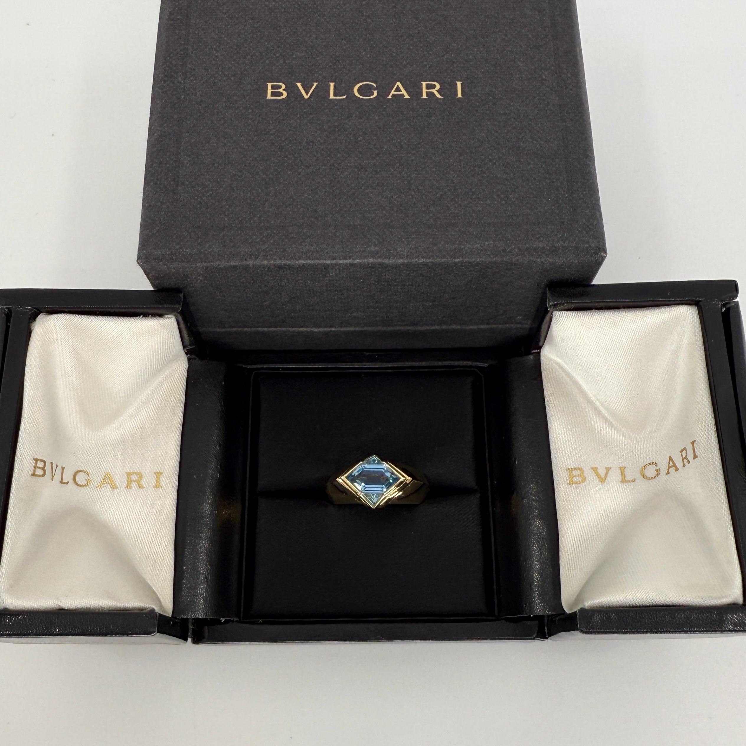 Rare Vintage Bvlgari Fancy Cut Blue Topaz 18k Yellow Gold Signet Bezel Rubover Ring.

This rare Bvlgari ring features three unique fancy cut Swiss blue Topaz gemstones set in a fine 18k yellow gold signet style ring. 
The centre topaz measures