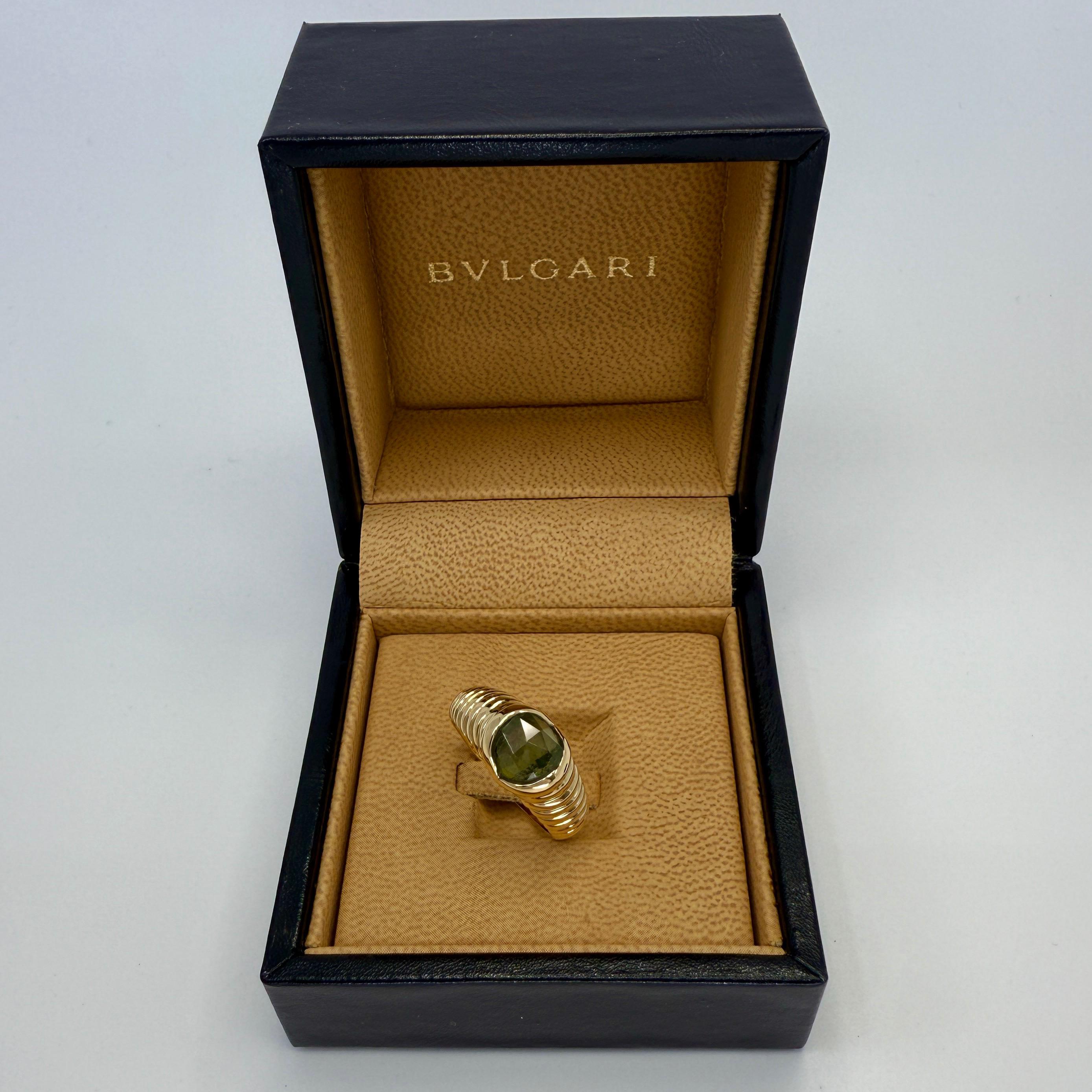 Rare Vintage Bvlgari Fancy Cut Green Tourmaline 18k Yellow Gold Doppio Ring.

Fancy cushion rose cut deep green tourmaline set in a fine 18k yellow gold tension ring from the rare Bvlgari 'Doppio' collection.

In good condition, has been