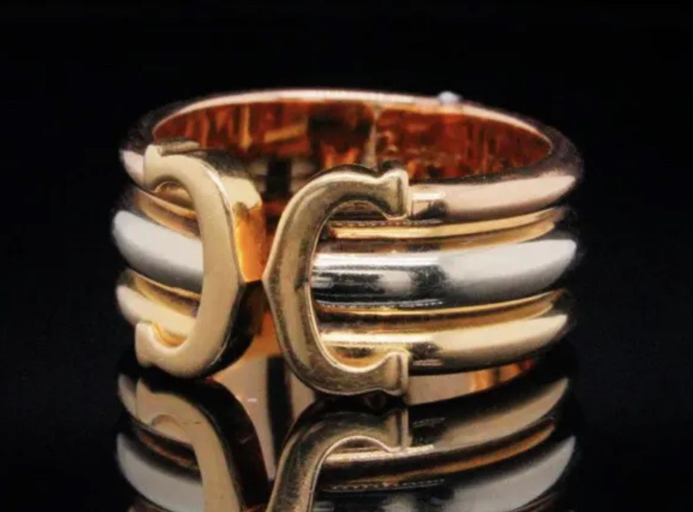 Cartier 18k Tri-Color Gold Double C Ring.



Cartier 18k tri-color gold double C decor ring. Features 18k yellow, white and rose gold bands finished at the top with a double C Cartier motif.

The ring measures 10mm wide and is signed “CARTIER” along