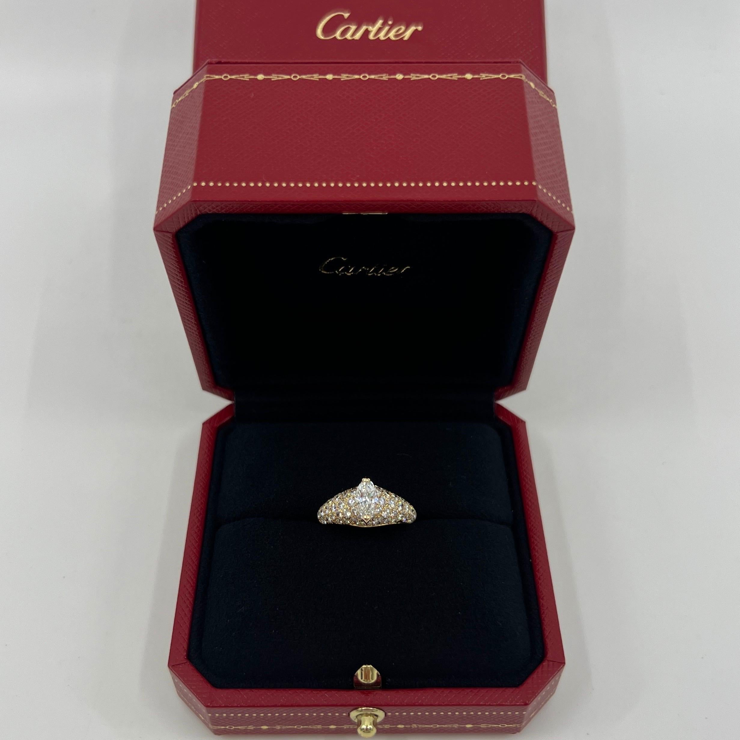 Rare Vintage Cartier Marquise Cut Natural Diamond 18k Yellow Gold Cocktail Cluster Ring.

A stunning yellow gold ring set with a fine marquise brilliant cut central diamond. Measuring approximately 9x4.3mm. Approx. 0.75 carat.
This is accented by 54