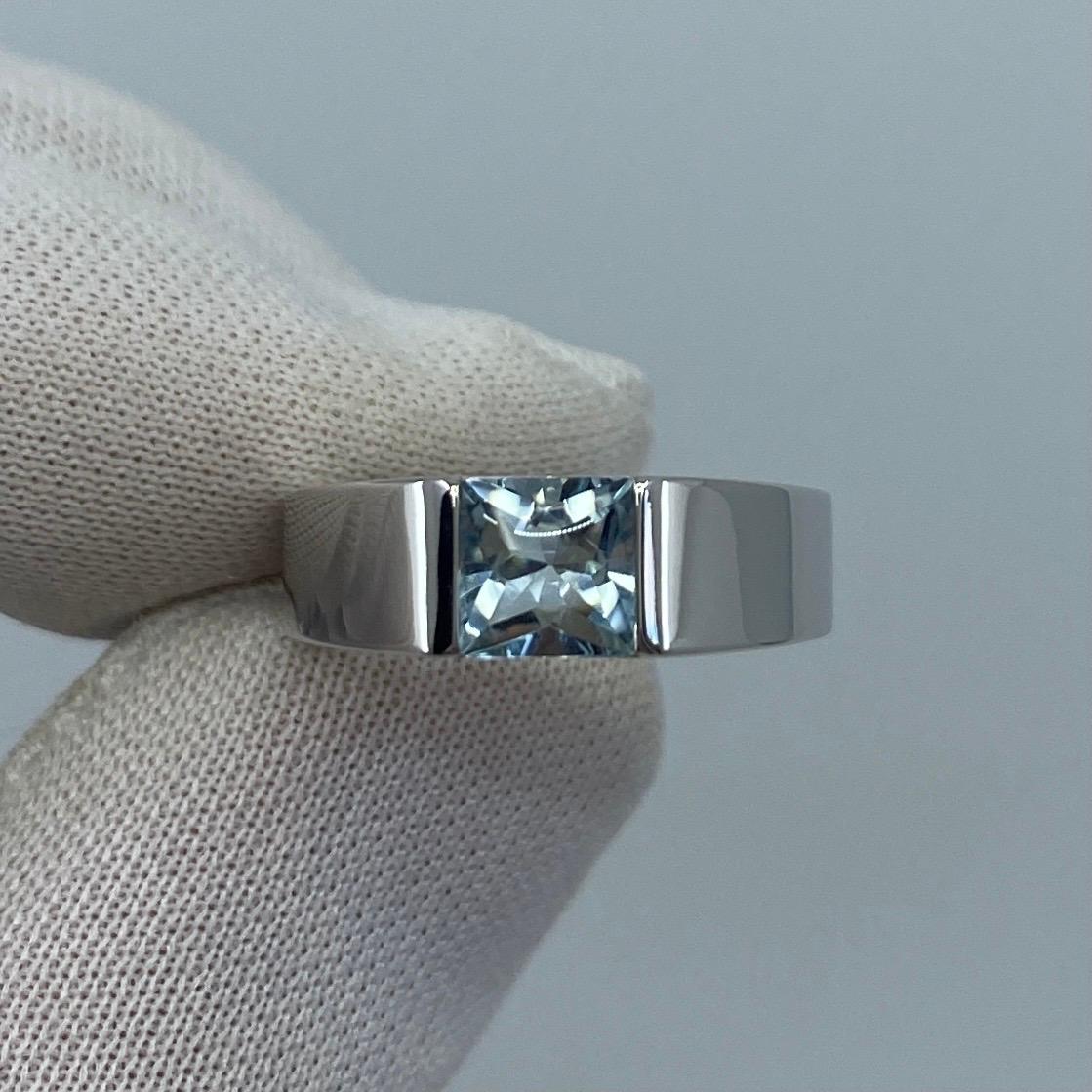 Vintage Cartier Blue Aquamarine 18 Karat White Gold Tank Ring.

Stunning white gold ring with a 6mm tension set blue aquamarine. 
Fine jewellery houses like Cartier only use the finest of gemstones and this aquamarine is no exception. A top grade