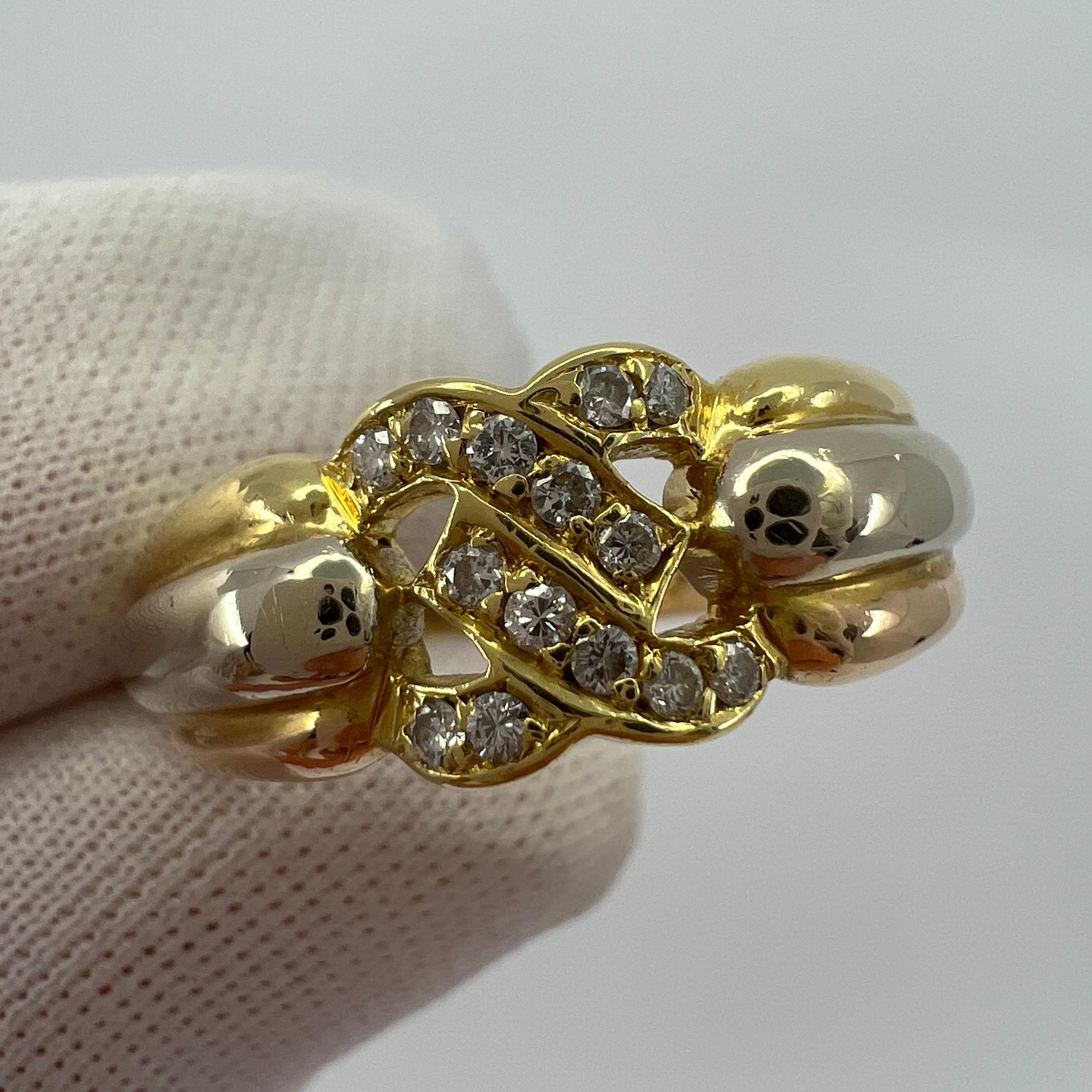Rare Vintage Cartier C Diamond Tri Colour 18k Gold Ring.

Stunning tri colour/multi tone gold ring featuring the iconic crossed 'C' design from Cartier. 

The interlocking C's are set with 14 round colourless diamonds. G/H colour Si1-2 clarity, all