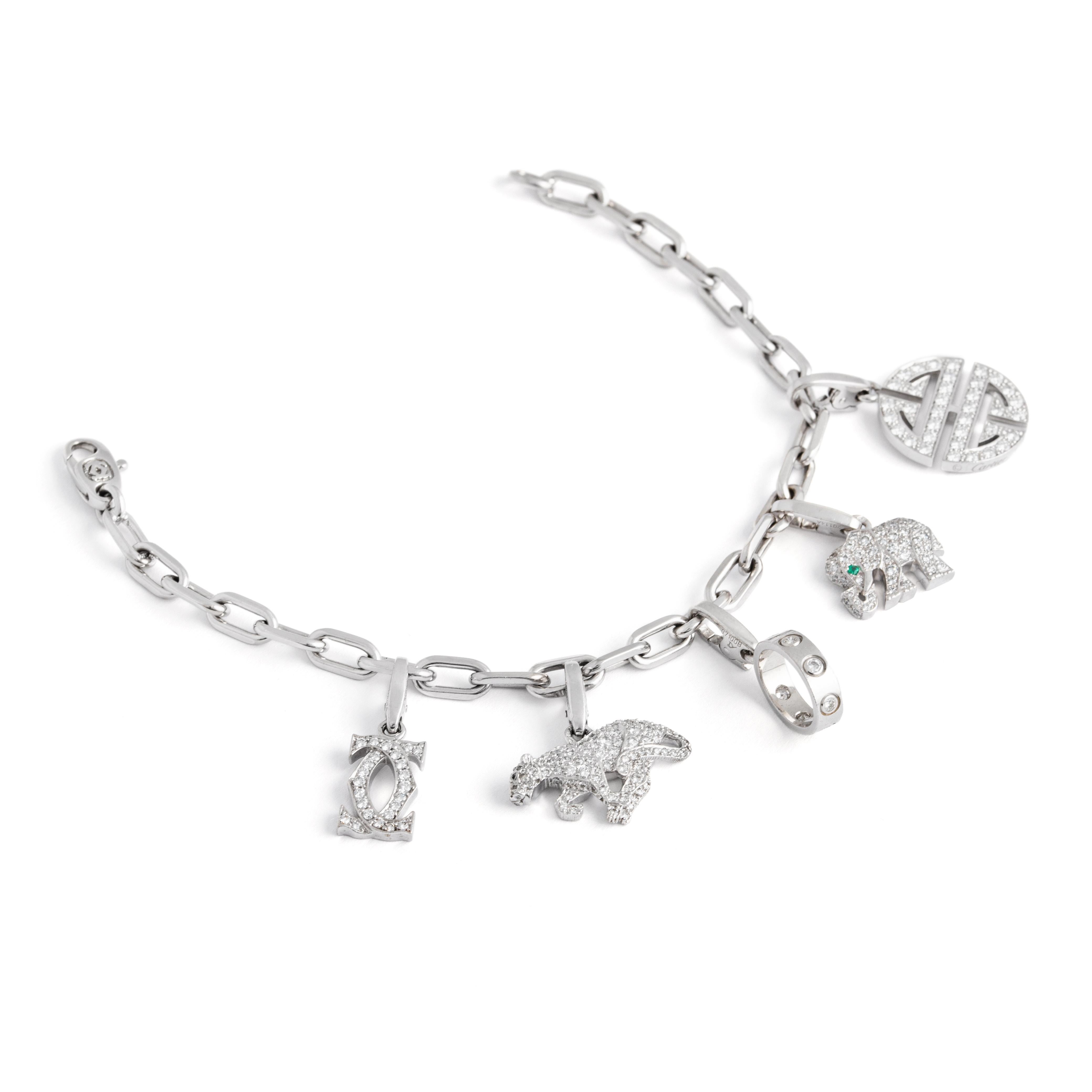 Rare Cartier Diamond Set Charm Bracelet White Gold 18K.
Each charm and the chain bracelet are respectively signed Cartier, numbered and marked and each one accompanied by an original Cartier certificate.

The piece is firstly composed of an elegant