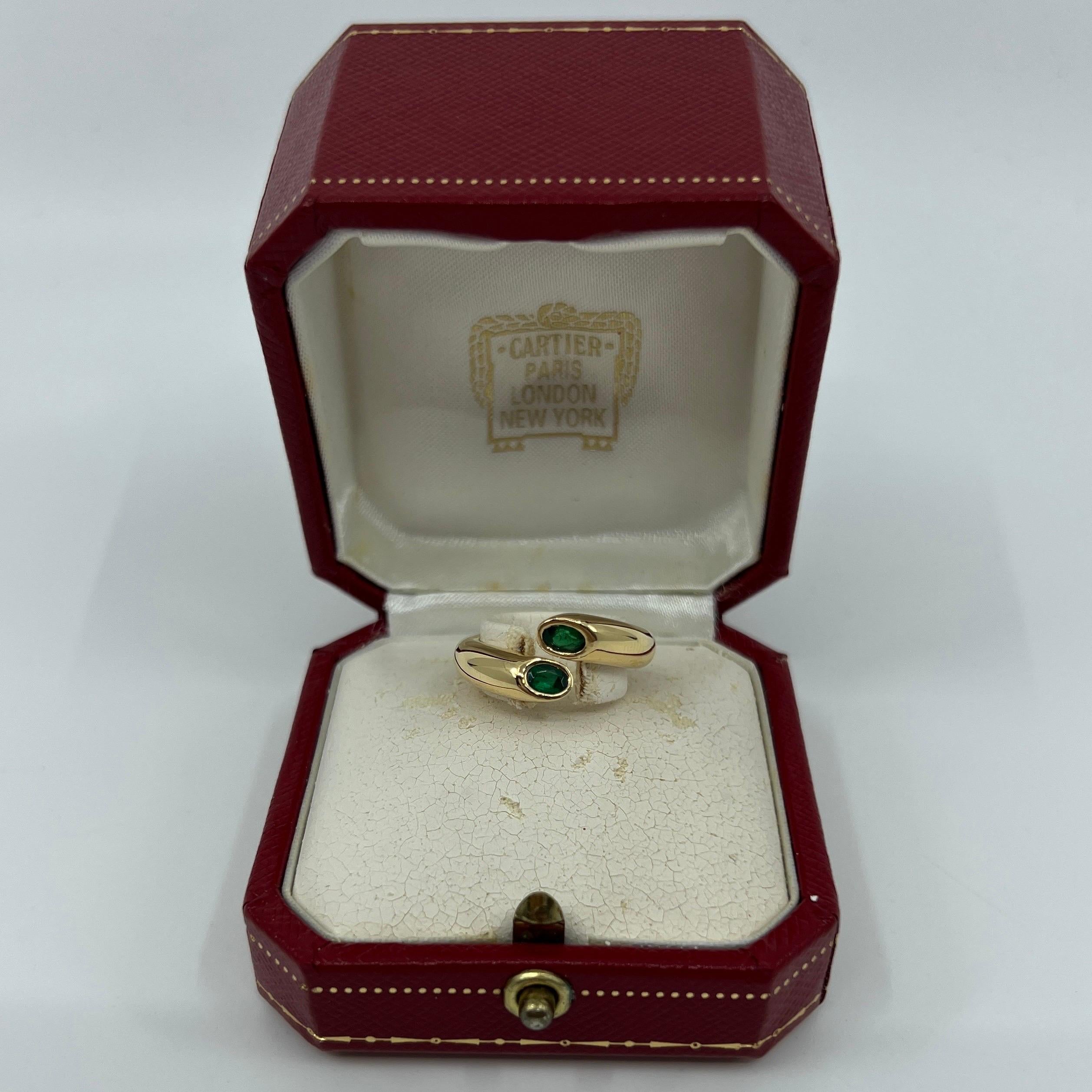 Vintage Cartier Deep Green Emerald 18k Yellow Gold Bypass Ring.

Stunning yellow gold ring set with 2 fine deep green oval cut emeralds. Fine jewellery houses like Cartier only use the finest of gemstones and these emeralds are no exception.

Two