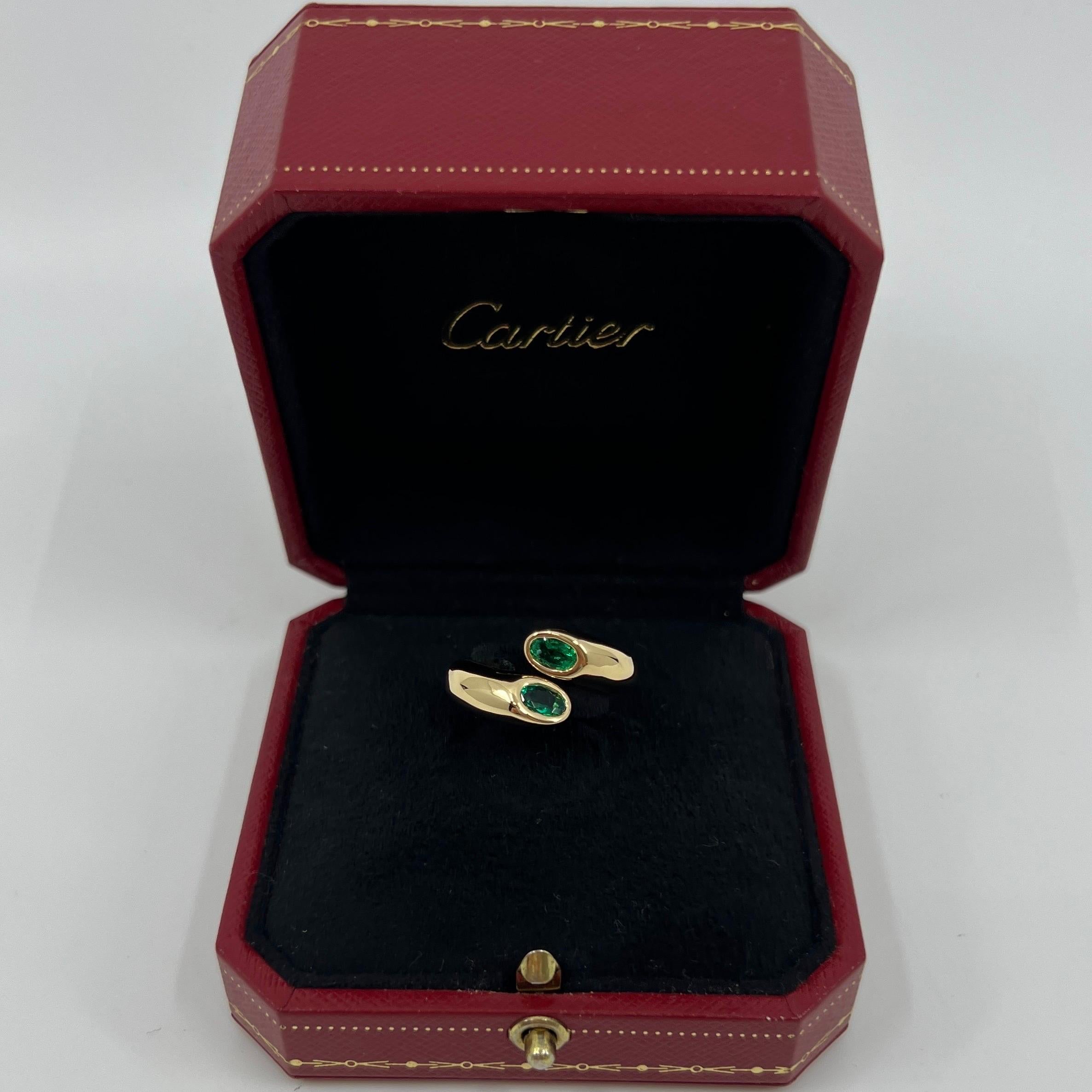 Vintage Cartier Vivid Green Emerald 18k Yellow Gold Bypass Ring.

Stunning yellow gold ring set with 2 fine vivid green oval cut emeralds. Fine jewellery houses like Cartier only use the finest of gemstones and these emeralds are no exception.

Two