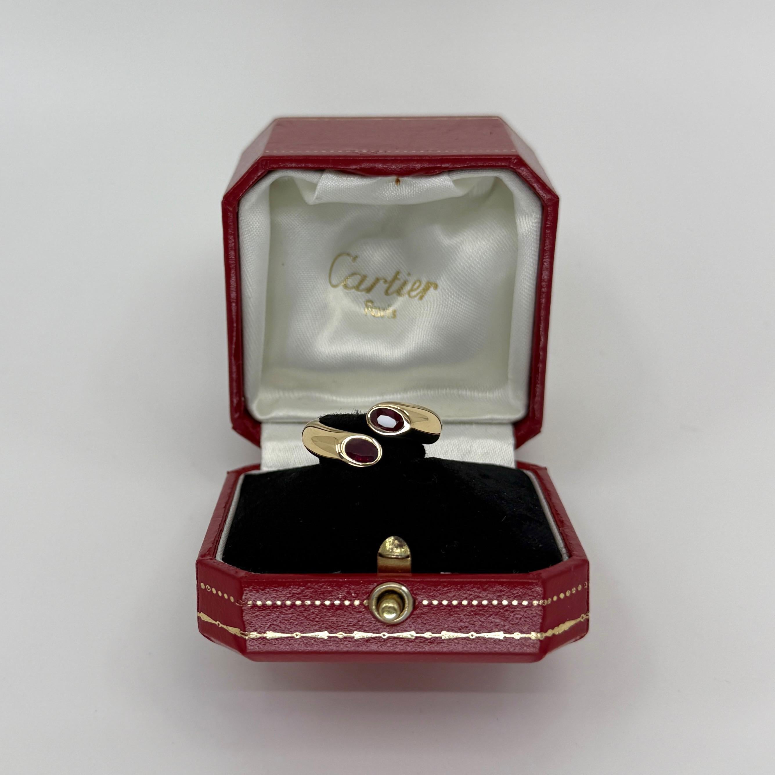 Rare Vintage Cartier Oval Cut Red Ruby 18k Yellow Gold Split Bypass Ring. Large ruby size.

Stunning yellow gold ring set with 2 fine deep red oval cut rubies. Fine jewellery houses like Cartier only use the finest of gemstones and these rubies are