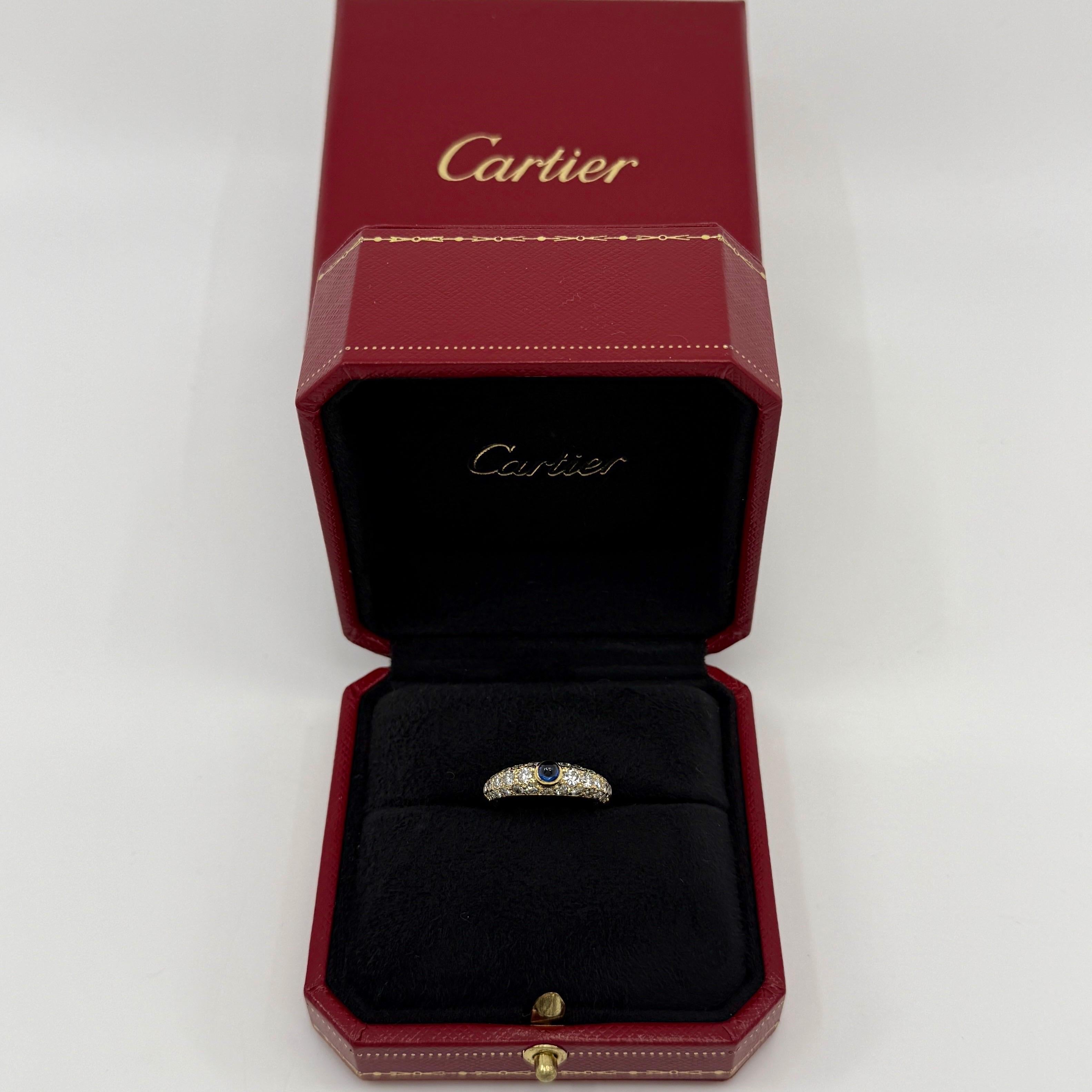 Rare Vintage Cartier Sapphire And Diamond 18k Yellow Gold Mimi Ring.

Stunning yellow gold Cartier ring set with a beautiful 4.2mm centre round cabochon sapphire with a deep blue colour and excellent clarity. 
This is accented by 30 natural round