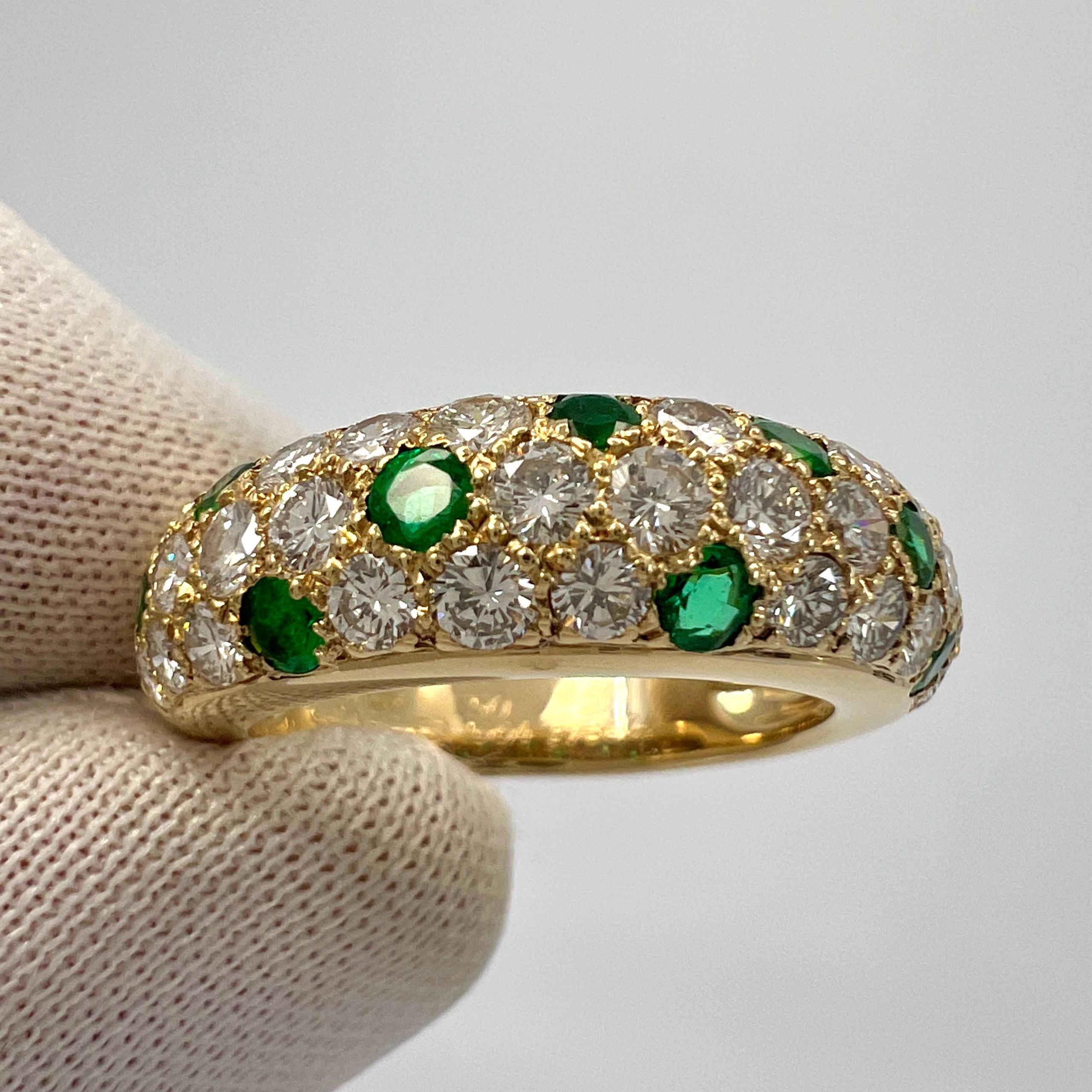Rare Vintage Cartier Vivid Green Emerald & Diamond 18k Yellow Gold Band Ring.

This beautifully made ring by Cartier features a curved dome design with three rows of beautifully set Pavé diamonds and emeralds going halfway around the band.

The