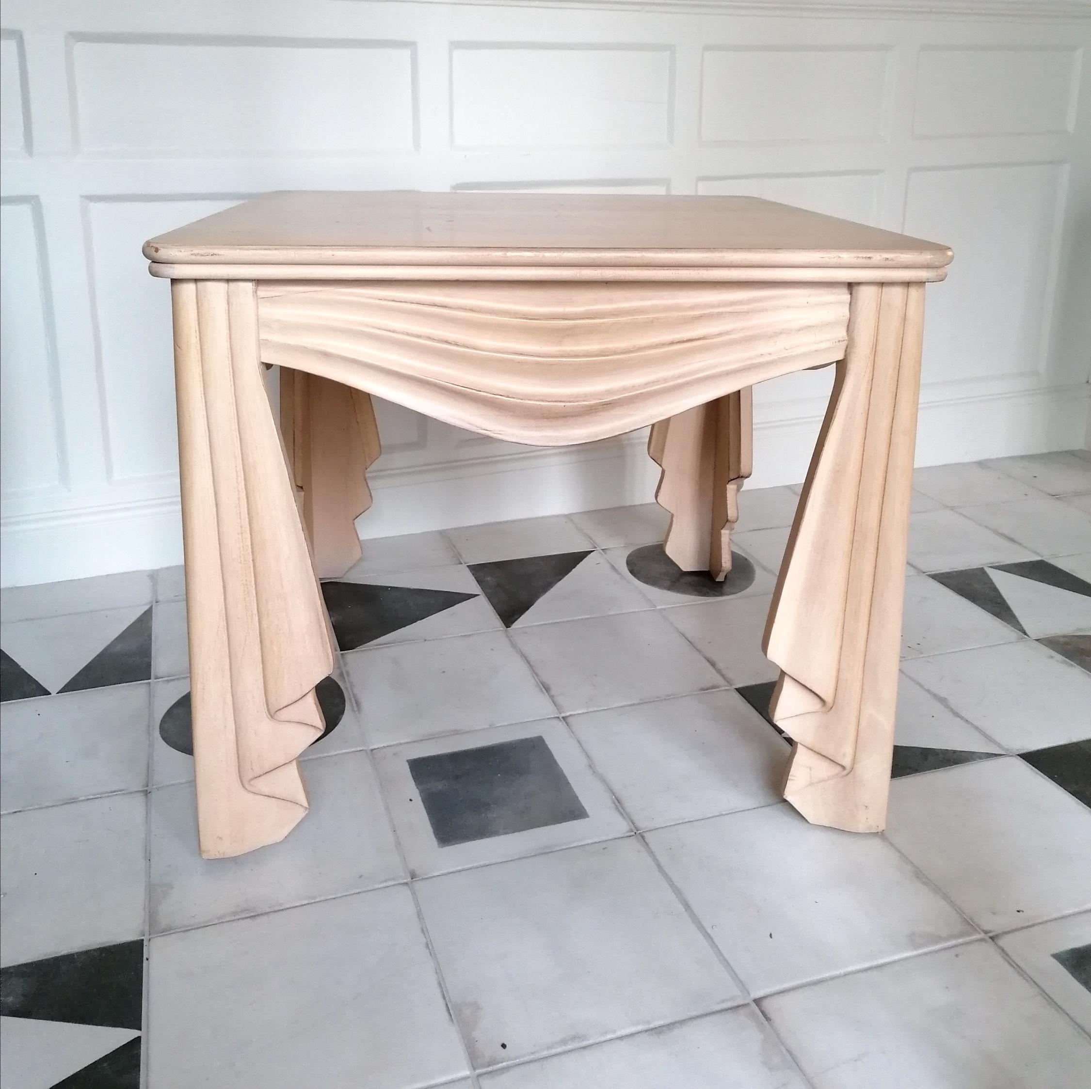 A rare carved wood trompe l'oeil draped swags side/end table, in its original blonde varnish.
USA, c1980s, in the manner of John Dickinson.