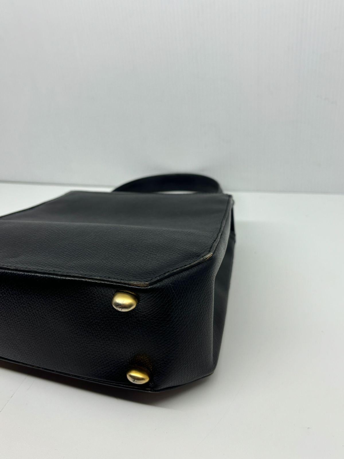 Rare vintage Celine triomphe bag. Can be worn as top handle bag or with its long adjustable strap. Comes as is with the removable strap. Overall in great vintage condition. Slight scuffing on the leather surface and scratches on the logo hardware. 