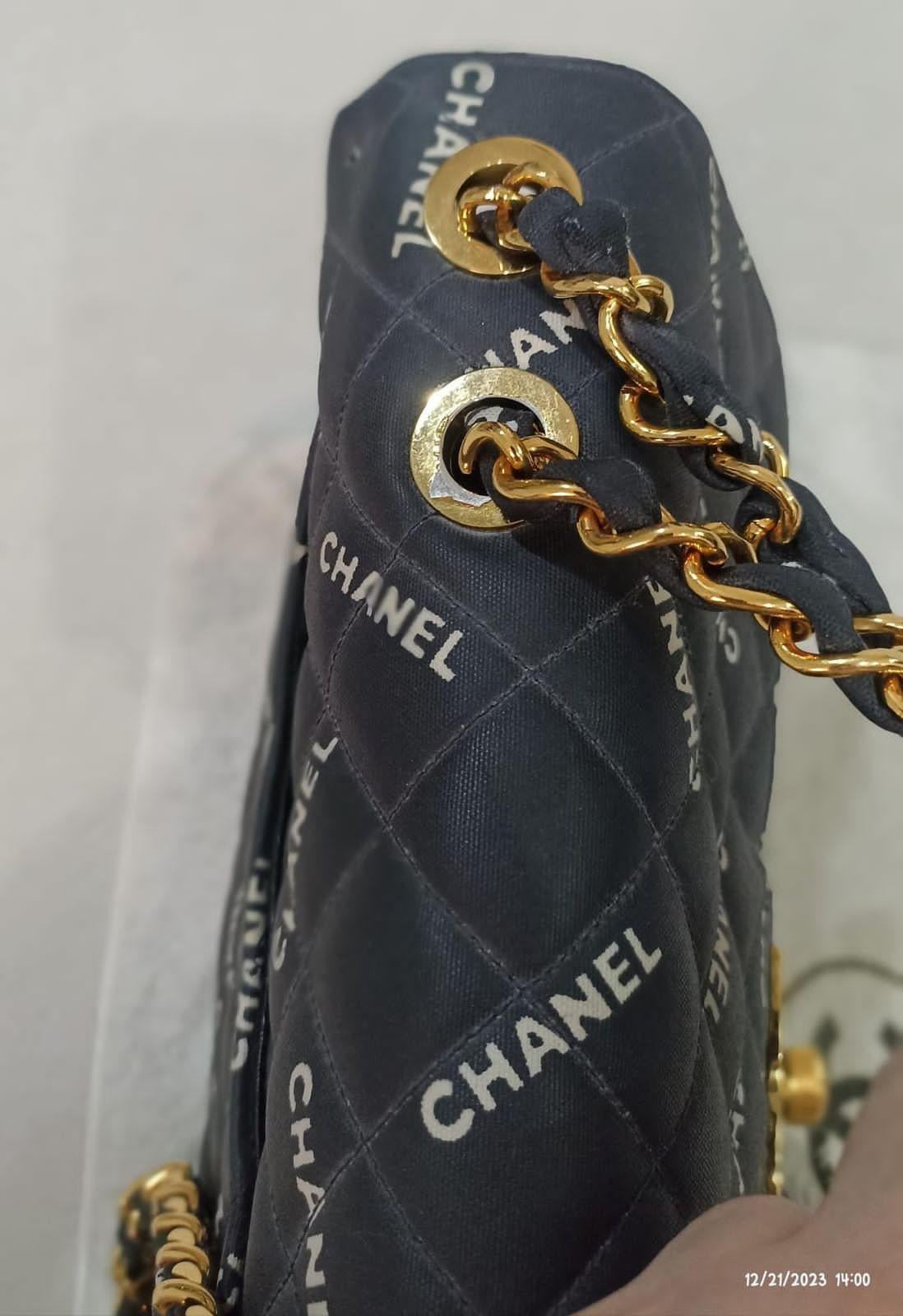 Rare Vintage Chanel Logo Printed Coated Canvas Maxi Flap Bag 12