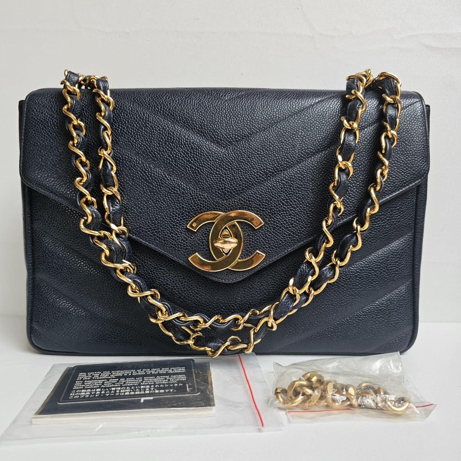 Rare vintage jumbo chevron quilt flap bag in blue caviar leather. Very good vintage condition overall. Series #3. The chain strap has been altered to only be worn as shoulder bag (the removed chain is included). Comes with its holo and card.