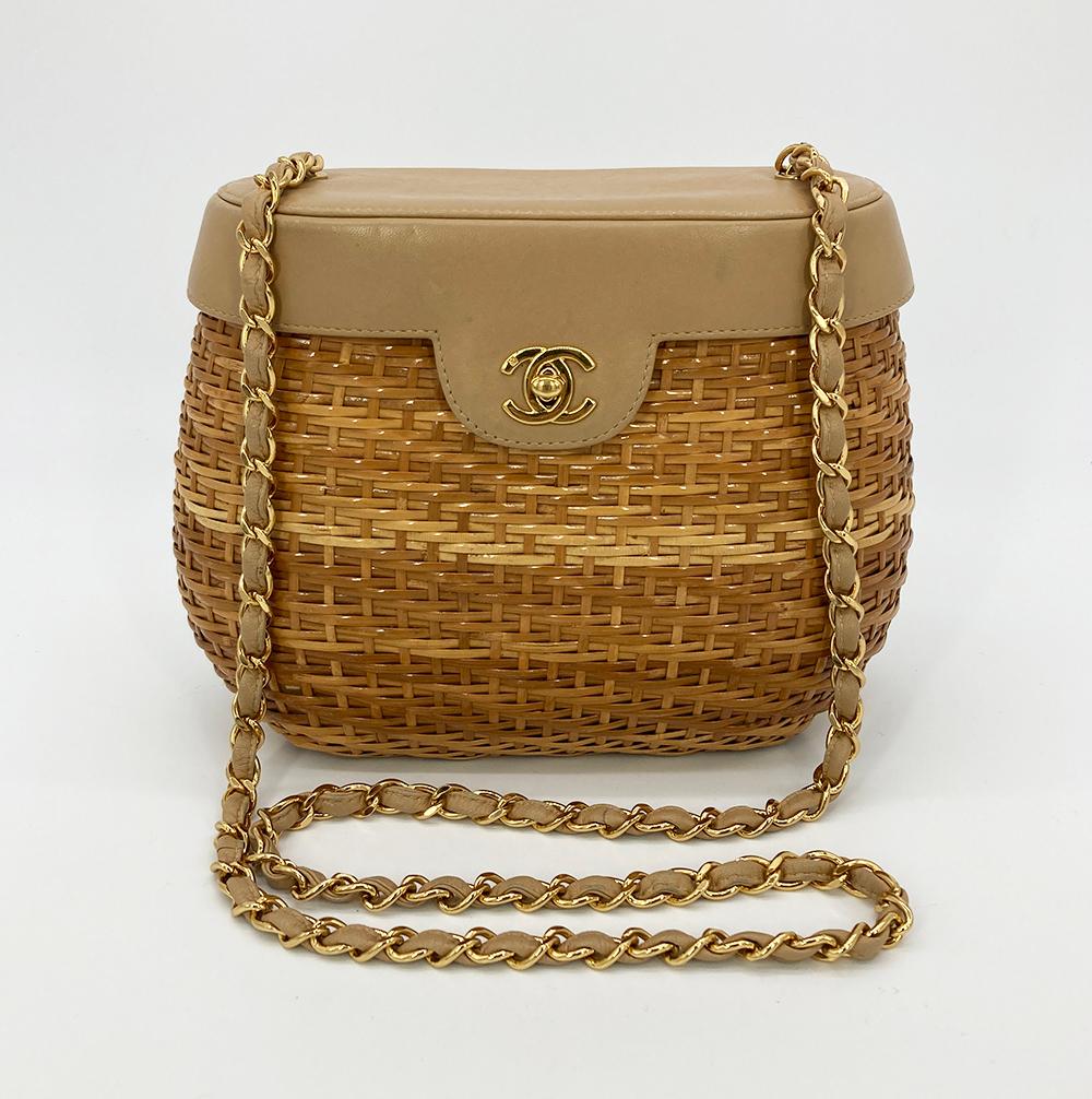 RARE VINTAGE Chanel Wicker Basket Bag in very good condition. Natural tan wicker basket body with tan leather top and gold hardware trim. woven chain and leather shoulder strap. Front twist CC logo closure opens to a tan leather interior with one