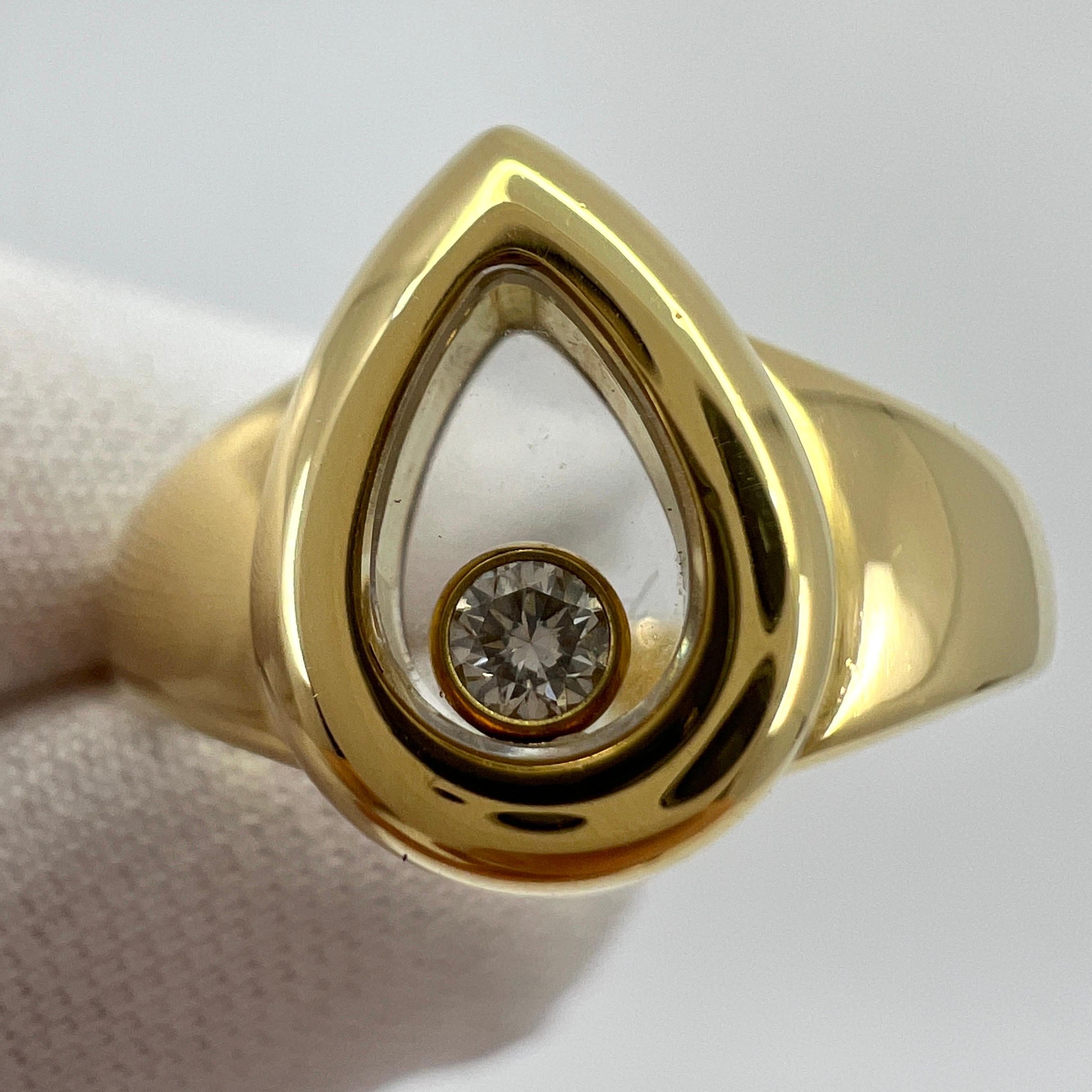 Rare Vintage Chopard Happy Diamonds Pear Shape 18k Yellow Gold Ring. 

Inspired by drops of water, Chopard's Happy Diamonds collection features diamonds that are free to swirl gracefully behind sapphire crystal glass, enhancing their sparkle with