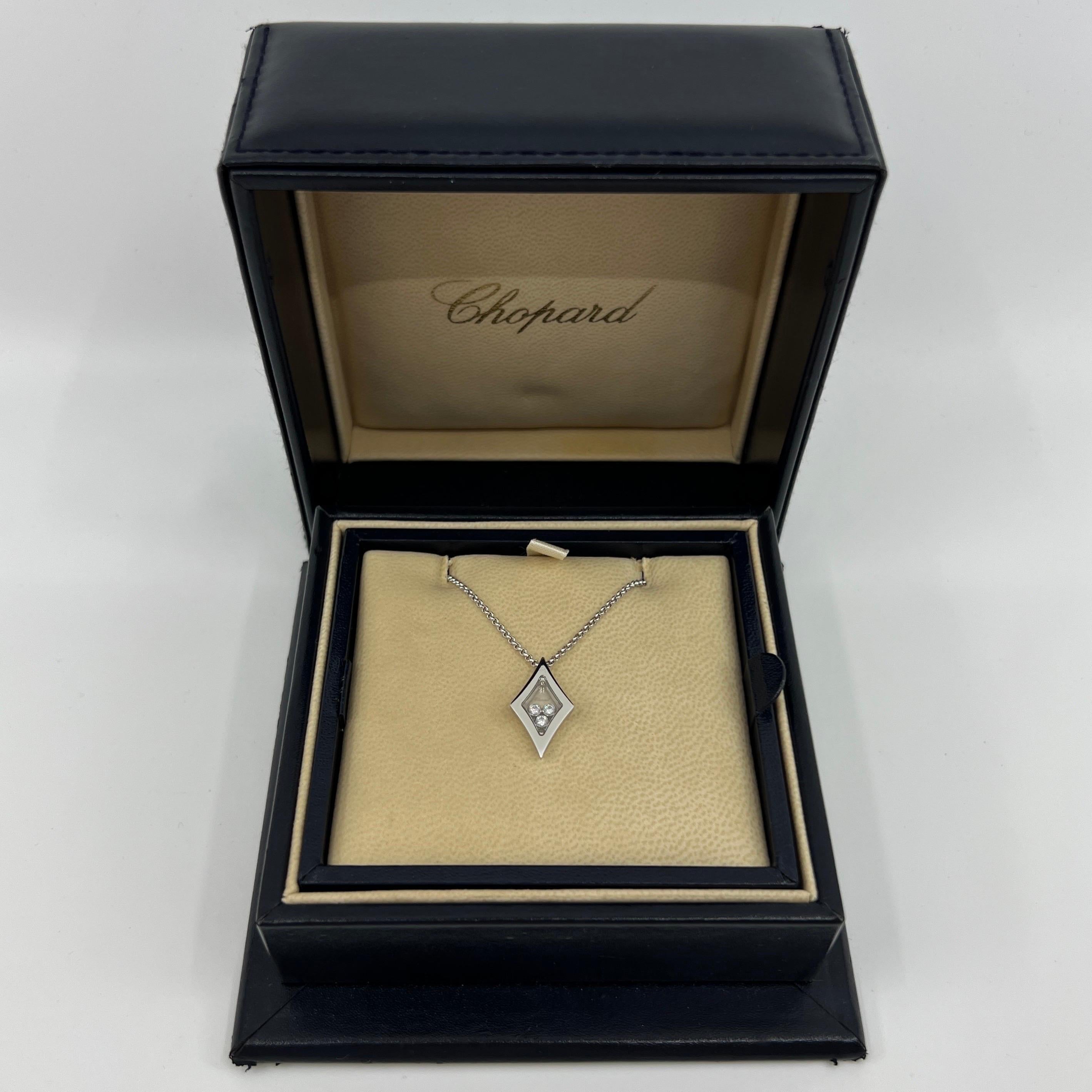 A Rare Chopard Happy Diamonds 18k White Gold Rhombus Pendant Necklace.

Inspired by drops of water, Chopard's Happy Diamonds Icons collection features diamonds that are free to swirl gracefully behind sapphire crystal glass, enhancing their sparkle