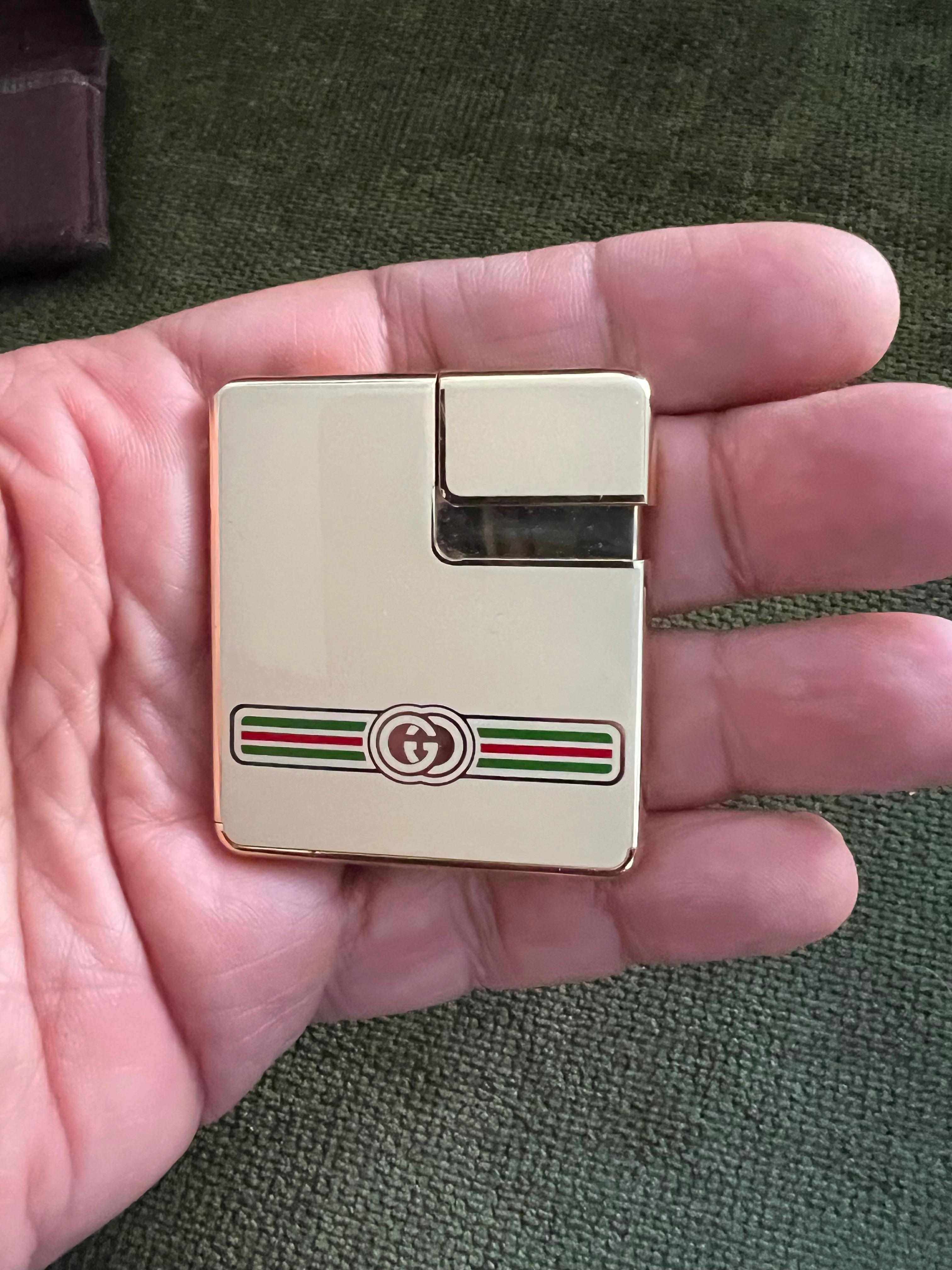 Rare Vintage Circa 1980s Logo Gucci Lighter In 18K Gold Plating & Cream Enamel 12