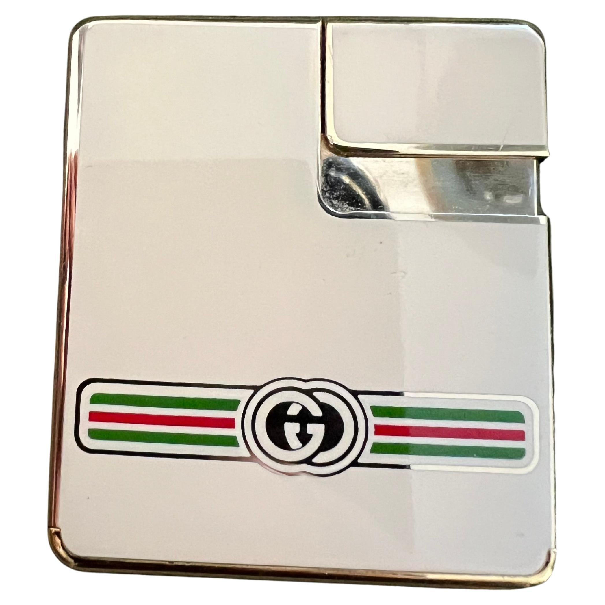 Vintage Circa 1980s Logo Gucci Lighter In 18K Gold Plating & Cream Enamel
This is a very rare Gucci Logo Circa 80s Lighter in amazing condition 
This lighter has been overhauled using all original parts to mint working condition. 
It has cream,