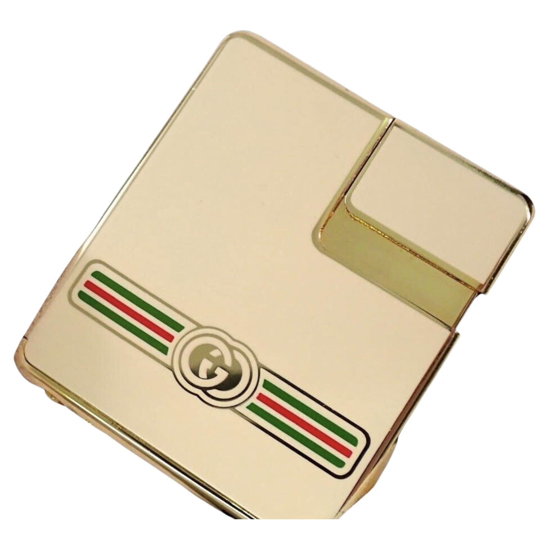 Rare Vintage Circa 1980s Logo Gucci Lighter In 18K Gold Plating & Cream Enamel In Excellent Condition In New York, NY