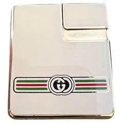 Rare Vintage Circa 1980s Logo Gucci Lighter In 18K Gold Plating & Cream Enamel