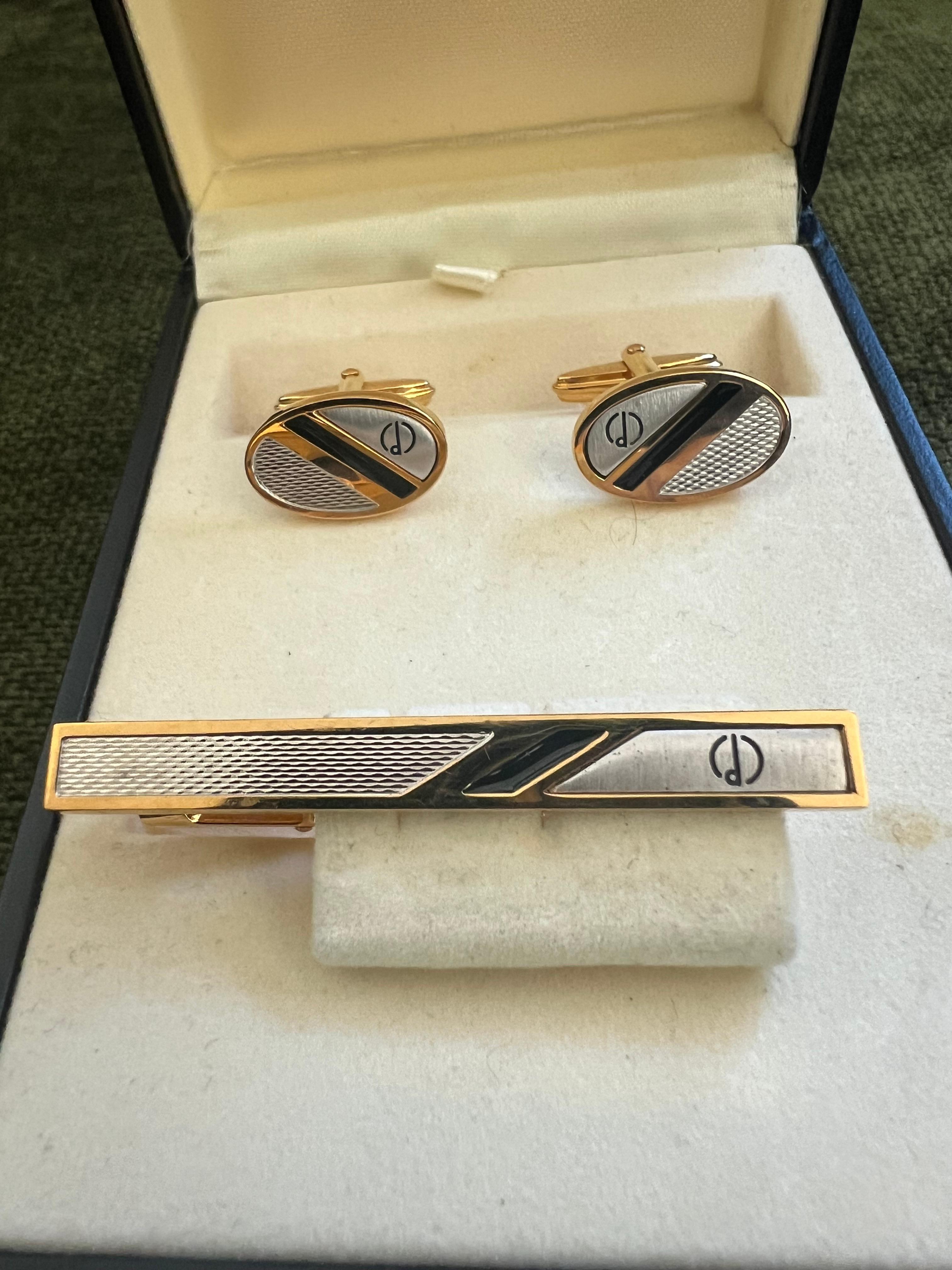 Rare Vintage Dunhill Cufflinks & Tie Clip Gold Plated, Onyx With Original Case 
Retro, Chic, Art Deco, Classic 
Elegant Vintage Dunhill Cufflinks 
Gold Plated 
“Circa 1970”
The Cufflinks are 18 k Gold Plated 
With original Dunhill case 
In mint