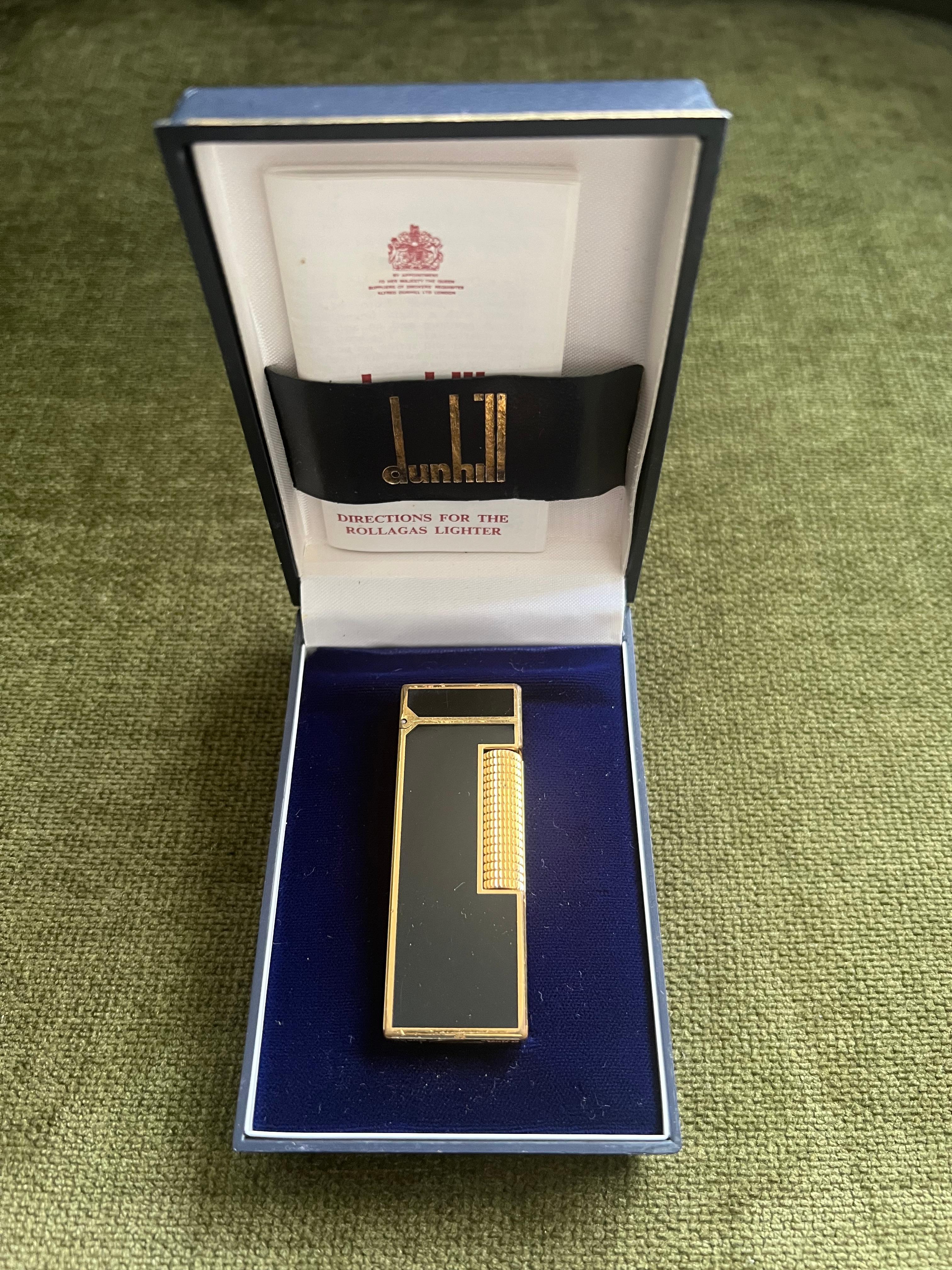 Rare Vintage Dunhill Gold Plated Black Lacquer Lighter Dunhill Original Case 
Circa 1970

Rare Vintage Dunhill gold plated Black lacquer Swiss Made lighter In mint condition.
Works perfectly. 
What makes our lighters the right choice to buy is their