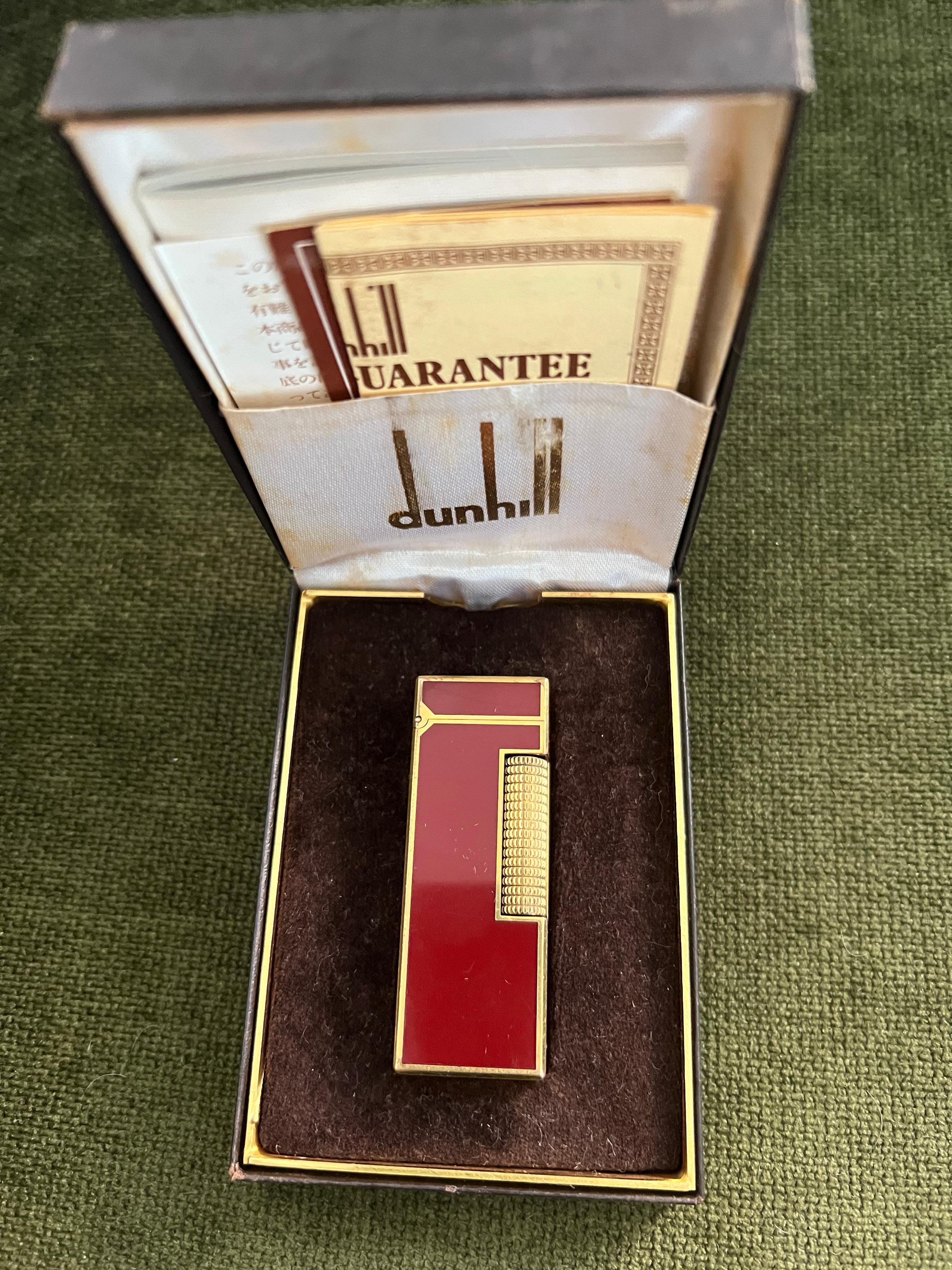 Rare Vintage Dunhill Gold Plated Red Lacquer Lighter Original Case 
Circa 1970

Rare Vintage Dunhill gold plated Red lacquer Swiss Made lighter In mint condition.
Works perfectly. 
Iconic and beautifully engineered piece with rare lacquer