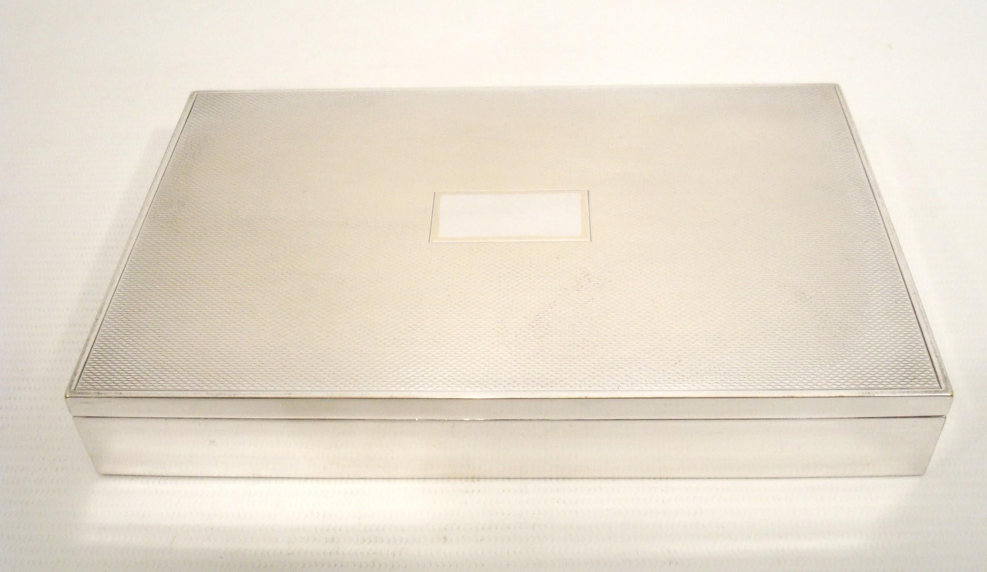 Rare vintage engine turned Hermès Box, France, circa 1960s.

Sleek and sophisticated, this table Cigar /  cigarette box is a mid-century design by Ravinet d’Enfert for Hermès. A slim, rectangular box designed to house cigarettes, it’s reminiscent of