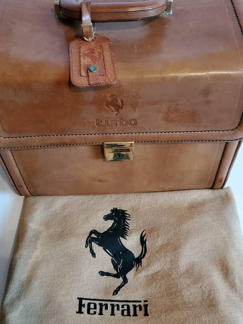 An exquisite, extremely rare and highly sought after, vintage Ferrari 208 Turbo fitted original Schedoni Italian brown leather travel bag luggage. Handcrafted in Modena, Italy, each piece of a set of three, custom designed and fitted to each