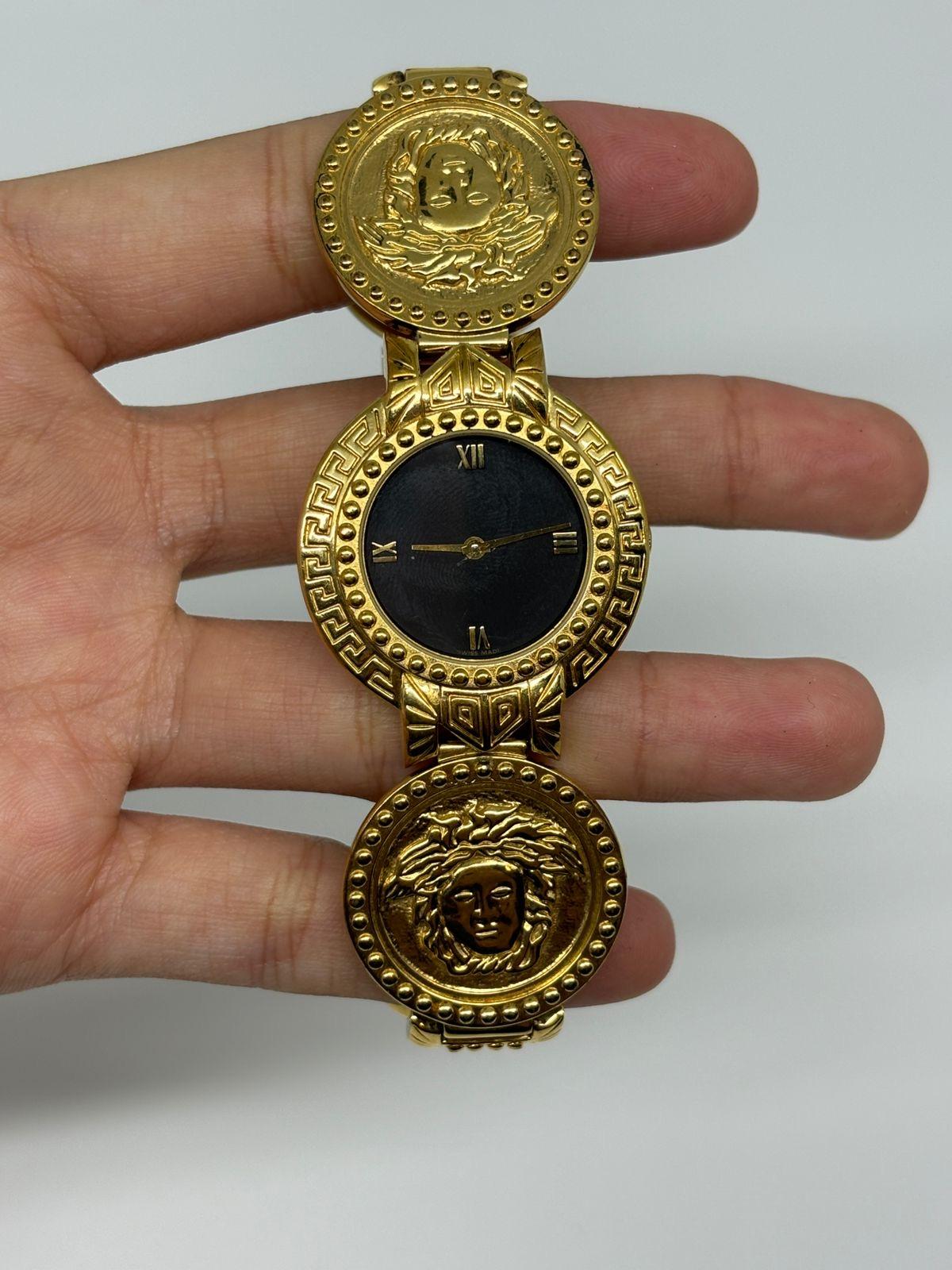 Beautiful rare vintage Gianni Versace Medusa Coin Wrist Watch in its original condition. Minor scratches on the hardware but not too visible. Diameter of the face is 31MM. A classic iconic piece. Functioning normally. Comes with its original receipt