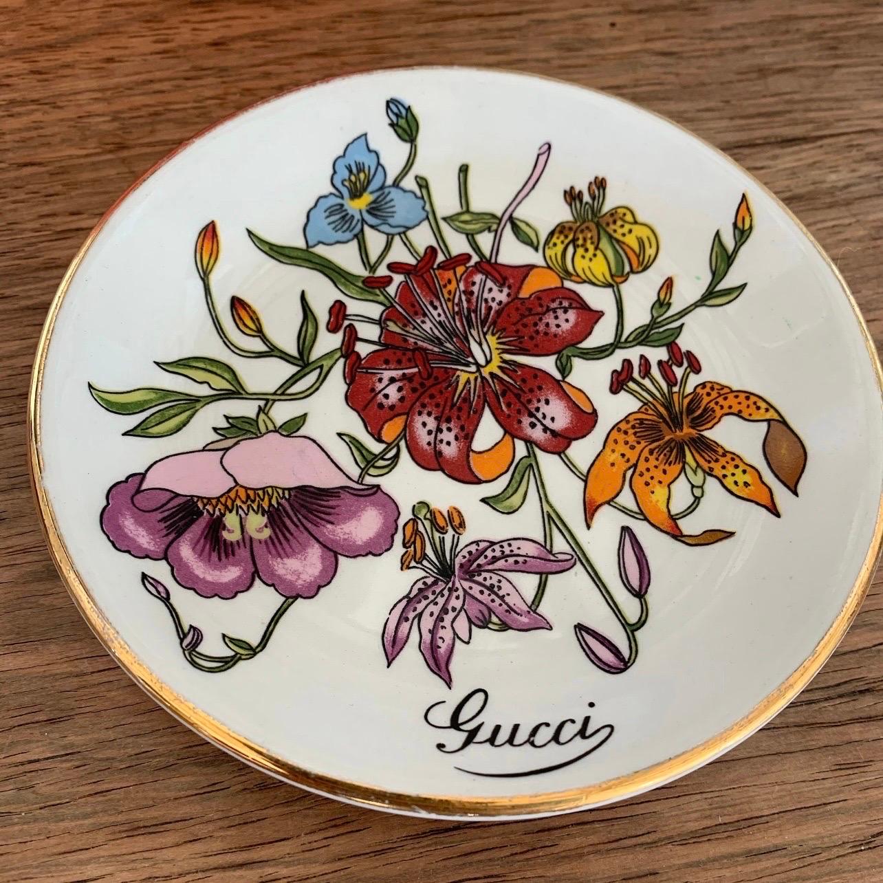 Very Chic and cool piece that is a total conversation starter! So many uses! Can be used as an ashtray, trinket dish, jewelry holder, decoration, candle holder etc. 

Iconic GUCCI Flora Print and Gucci Monogram logo really make this piece pop!

This