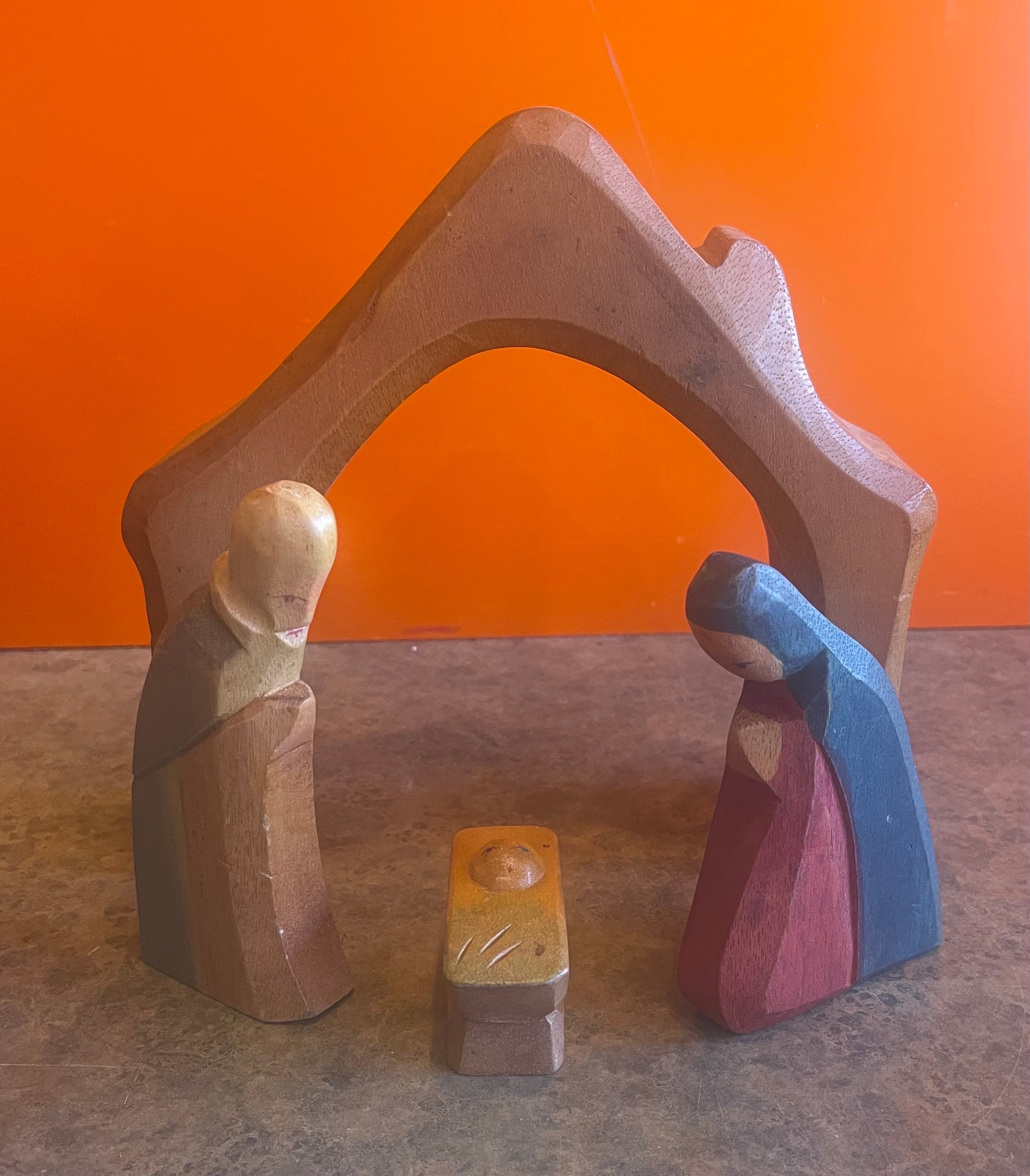 Rare vintage hand carved 16 piece nativity set by Department 56, circa 1980s. Each piece is hand carved wood that is hand painted; the set comes with 16 pieces (including a manager, 3 trees, 3 wiseman and 6 animals, Mary, Joseph and Baby Jesus).