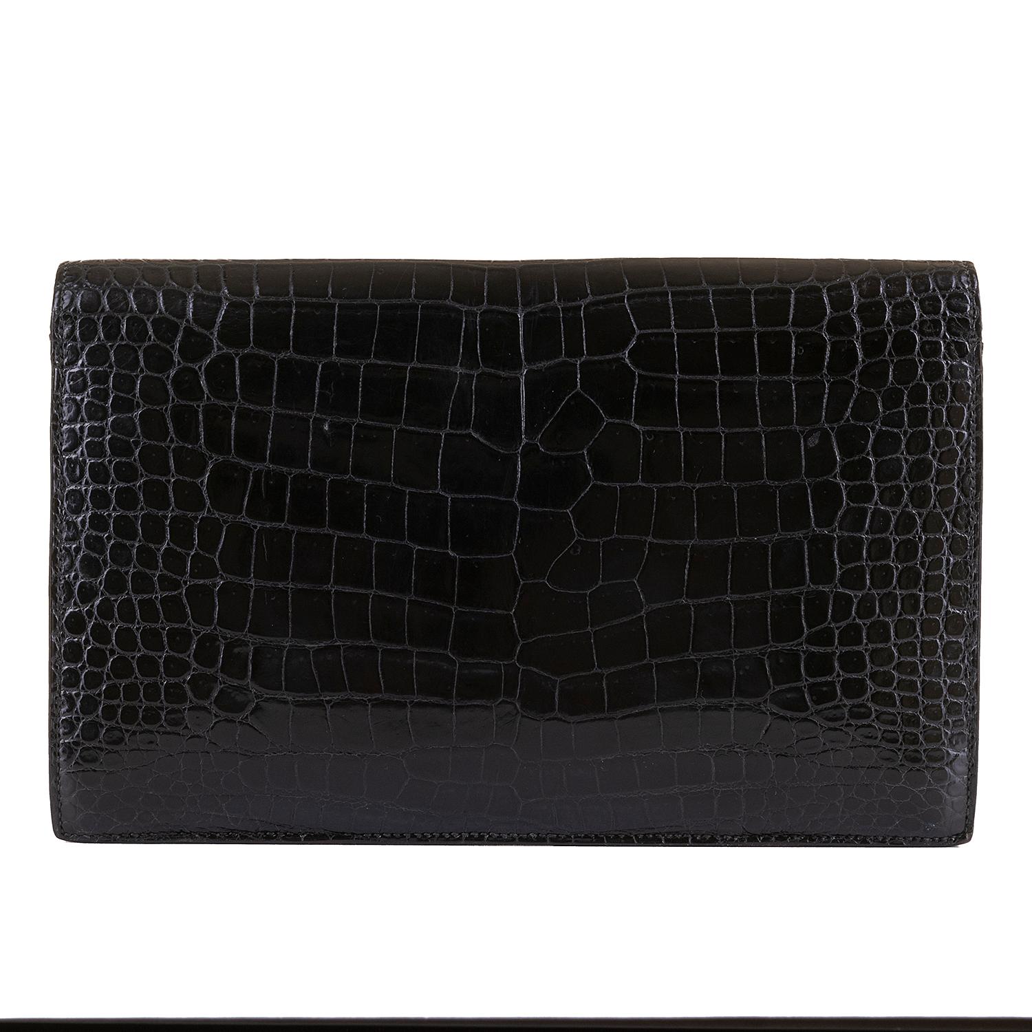 A very rare vintage Hermes 'Sac Lydia' Envelope Black Crocodile Evening Bag. In excellent condition throughout, the bag, with it's detachable Crocodile Strap, can be worn as either a clutch or shoulder bag. With gold hardware, this beautiful bag is