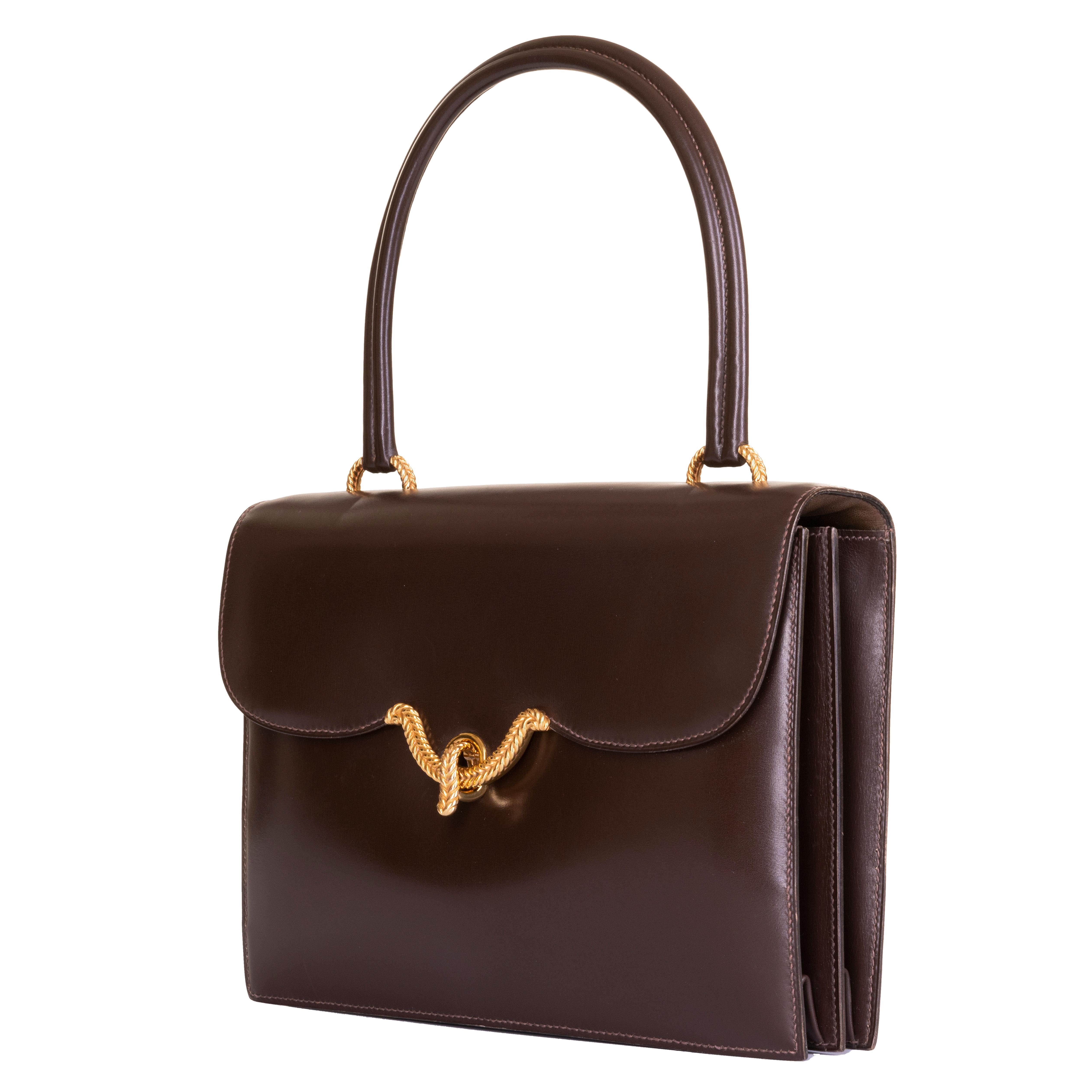 In excellent condition throughout, the 'Sac Cordeliere' is a rare vintage Hermes Handbag. This exquisite example is finished in Chocolate brown Box leather with 18ct. gold-plated hardware. Very lightly used, the bag is from a private collection in