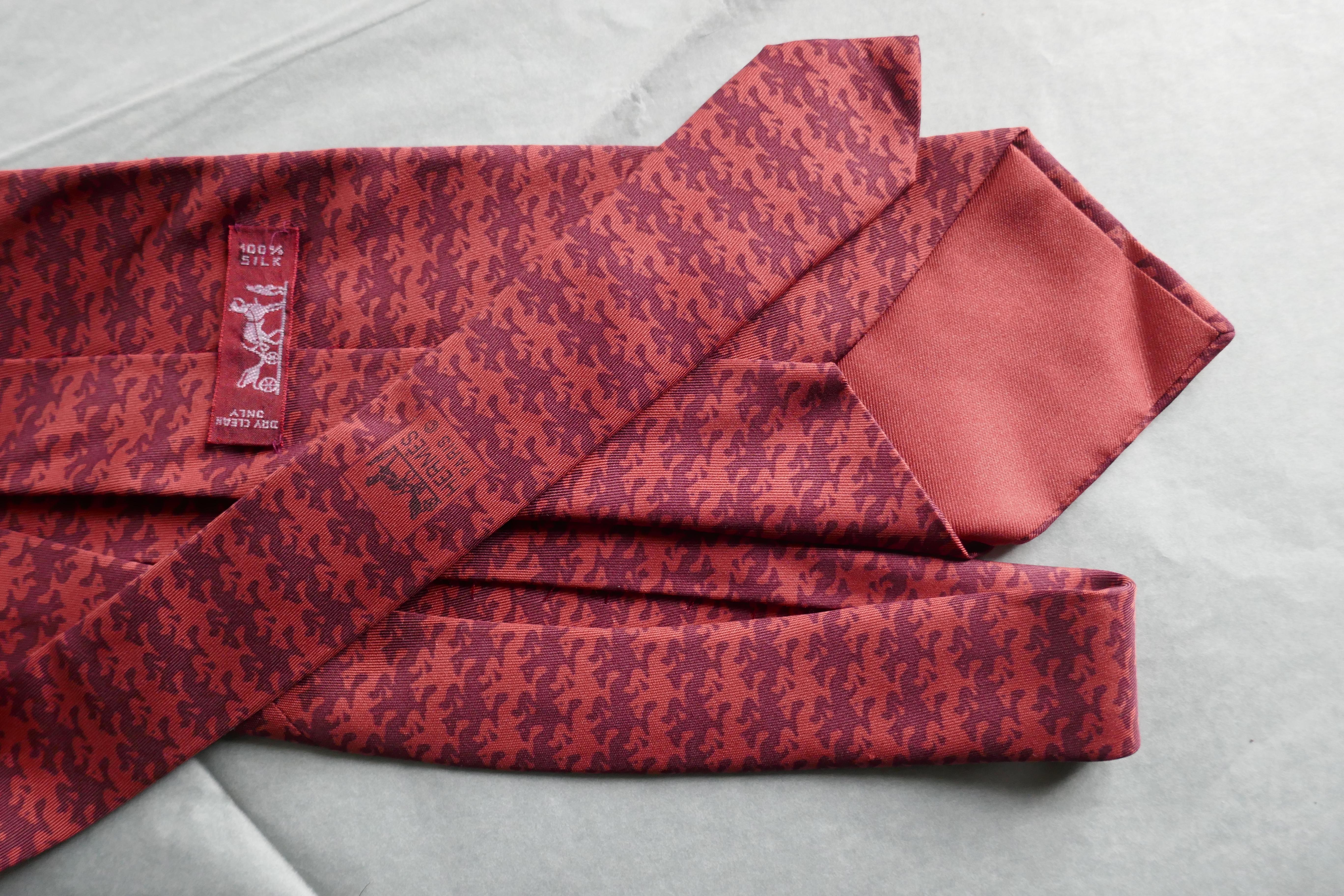 Rare Vintage Hermes Silk Tie, Racing Jockeys Ruby and Claret Red Pallet 

Classic Hermes All Over Horse Racing Design
A Rare Colour-way Claret 
A Very Special tie, instantly recognisable as Hermes by those in the know
100% silk 
Silk Lined in Soft